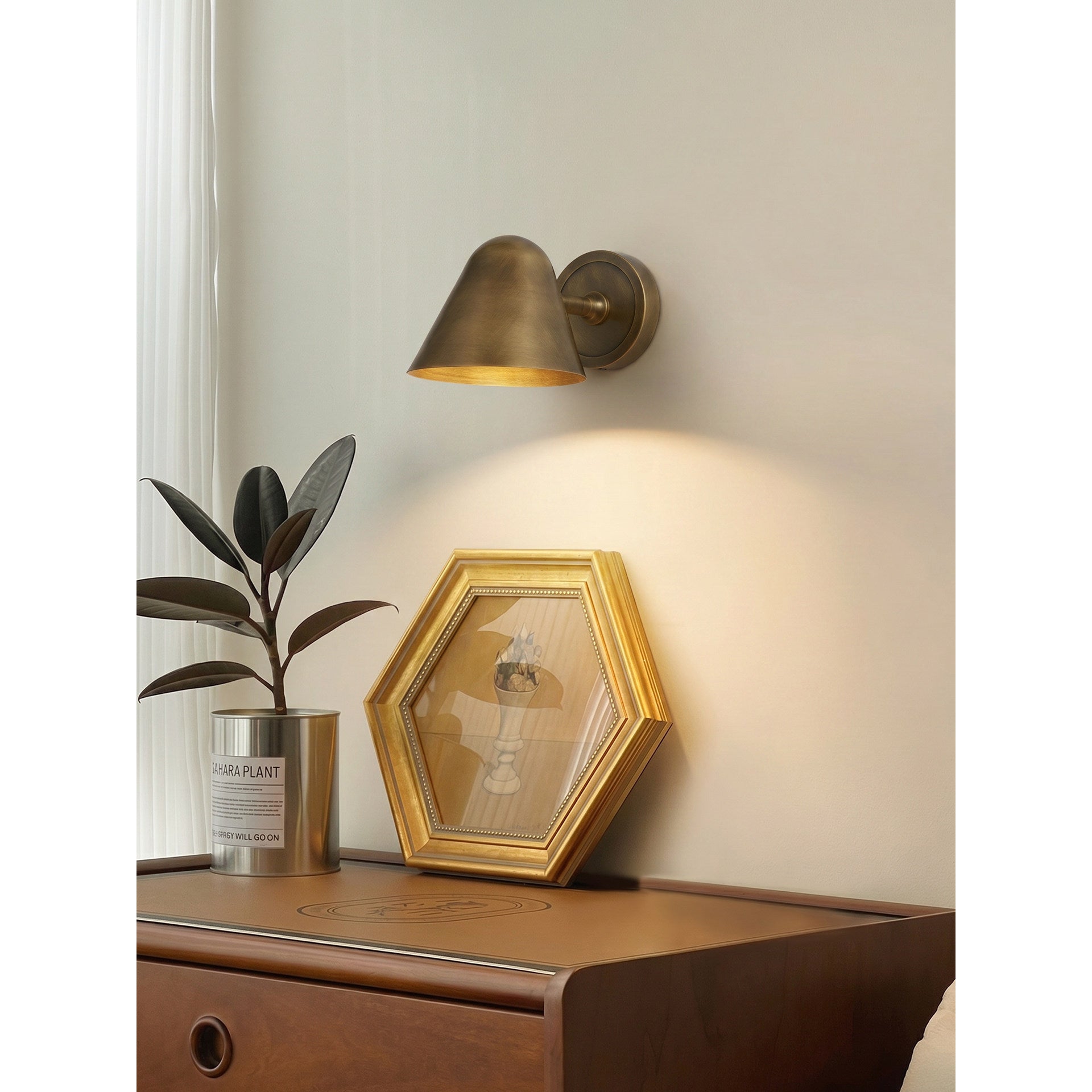 Angled shot of the Casa Cone Wall Sconce in antique bronze.