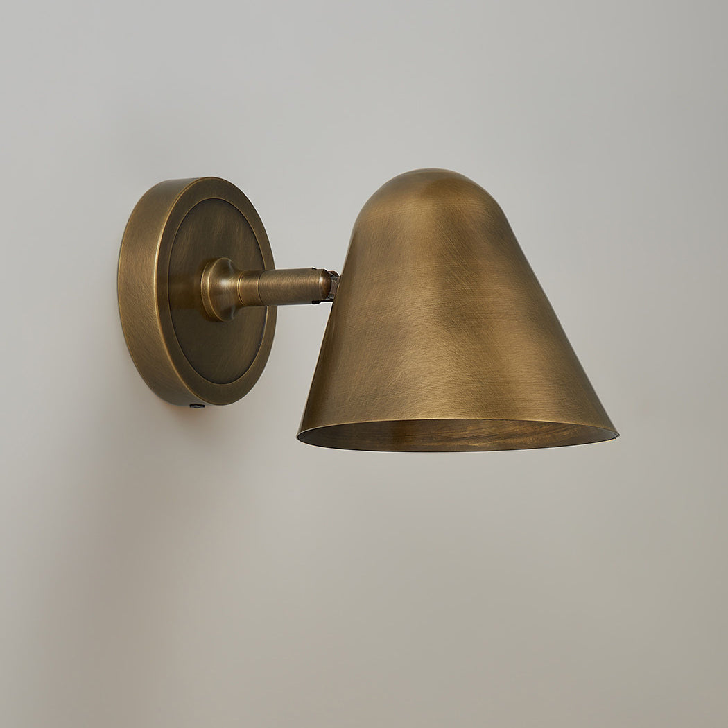 Detailed shot of the brass conical metal shade.