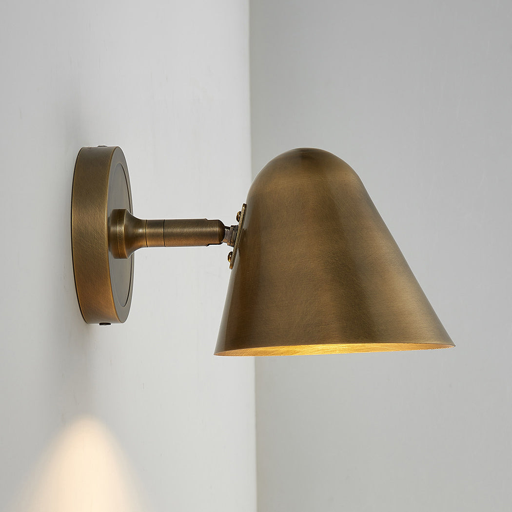The antique bronze sconce in a transitional style interior.
