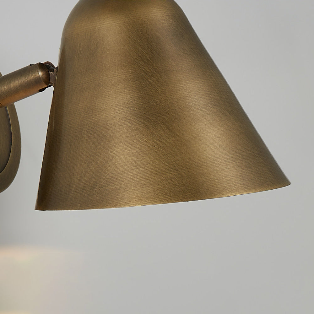 The sconce installed above a small hallway side table.