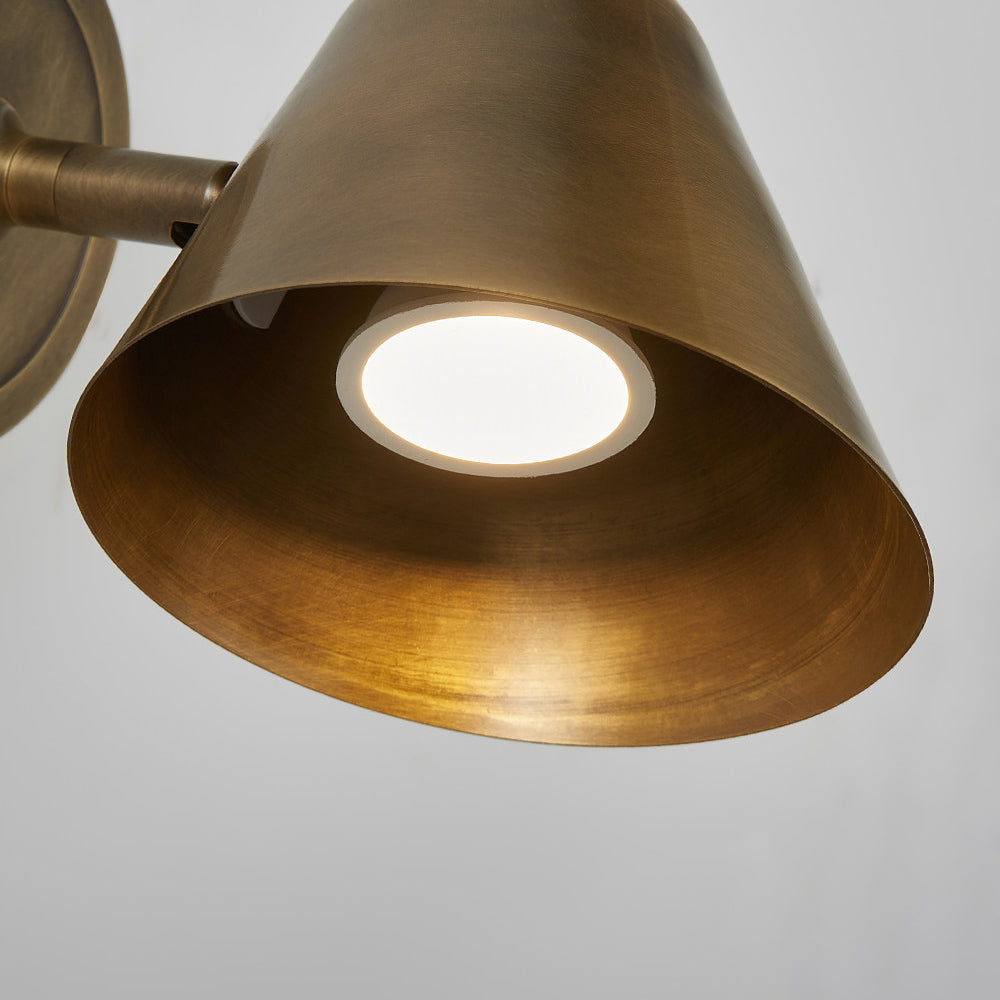 Full product shot of the Casa Cone Wall Sconce in brass on a white background.