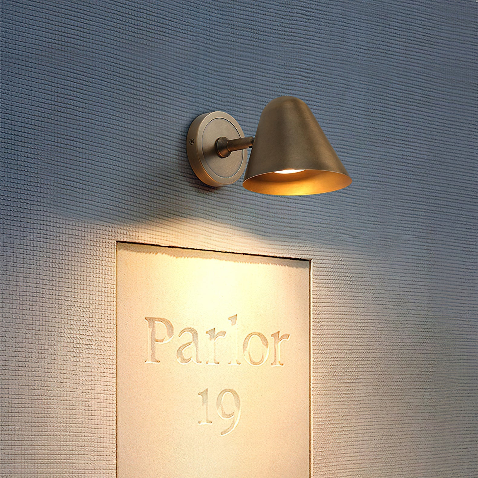 A pair of Casa Cone Wall Sconces used as bedside reading lights.
