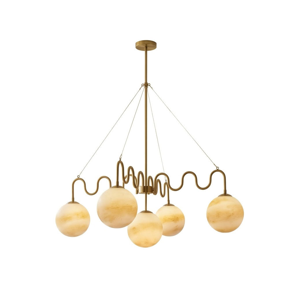 Cecil Balanced Glass Chandelier in brass finish against a neutral wall.