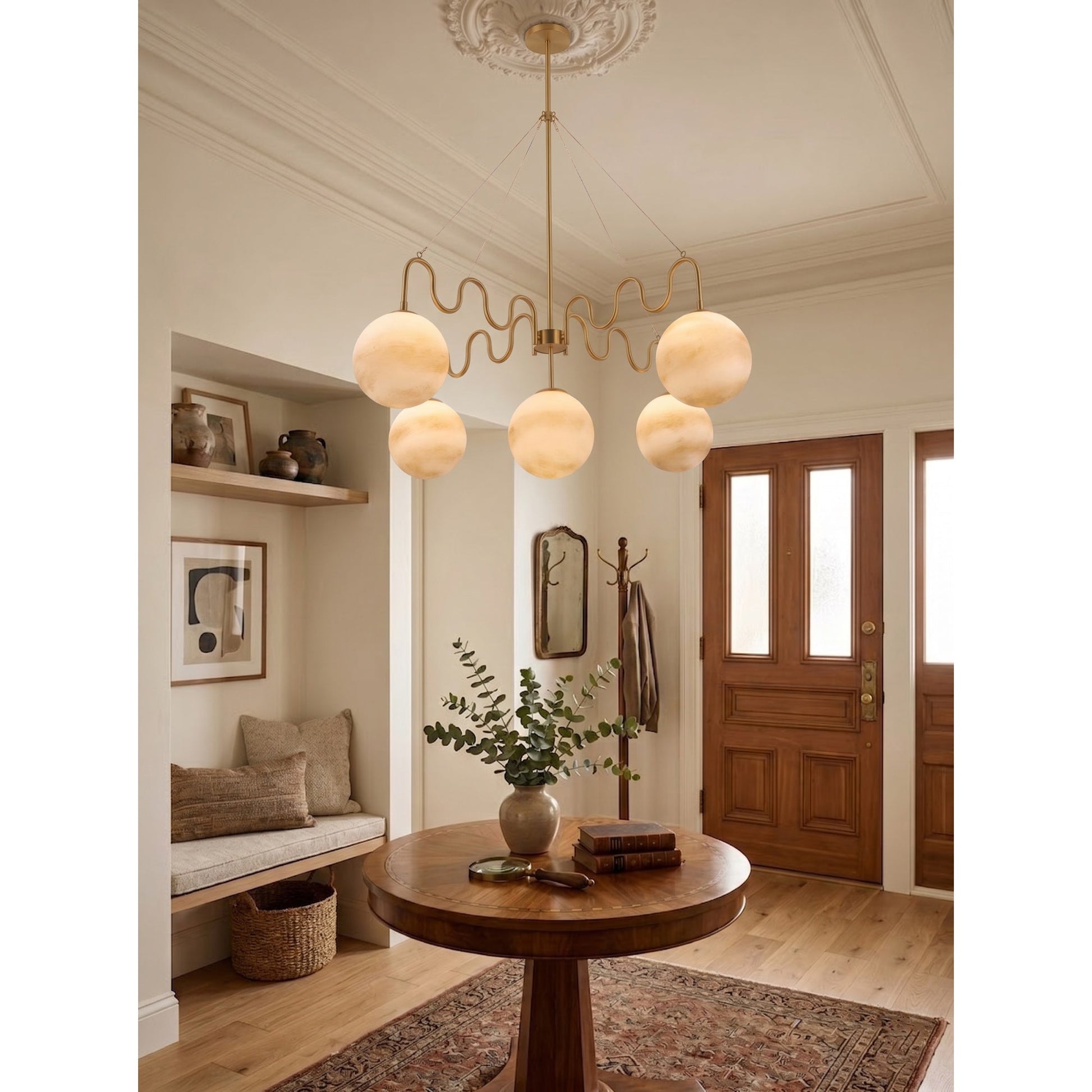 The black finish Cecil Chandelier viewed from the side in a minimalist setting.