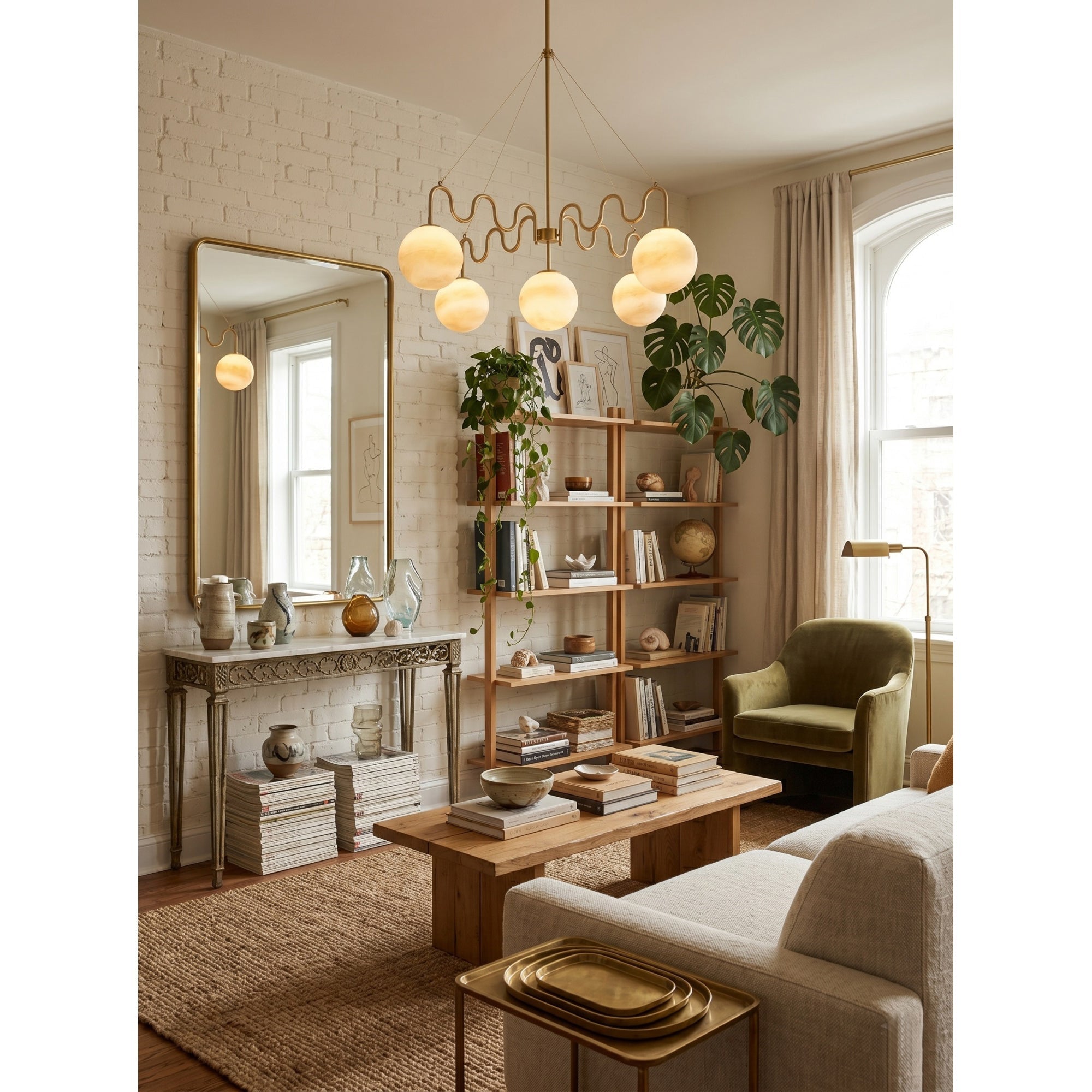 A pair of illuminated glass globes on the Cecil Chandelier.