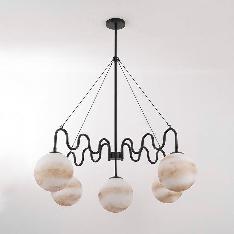 The sleek and modern nickel finish of the Cecil Chandelier.