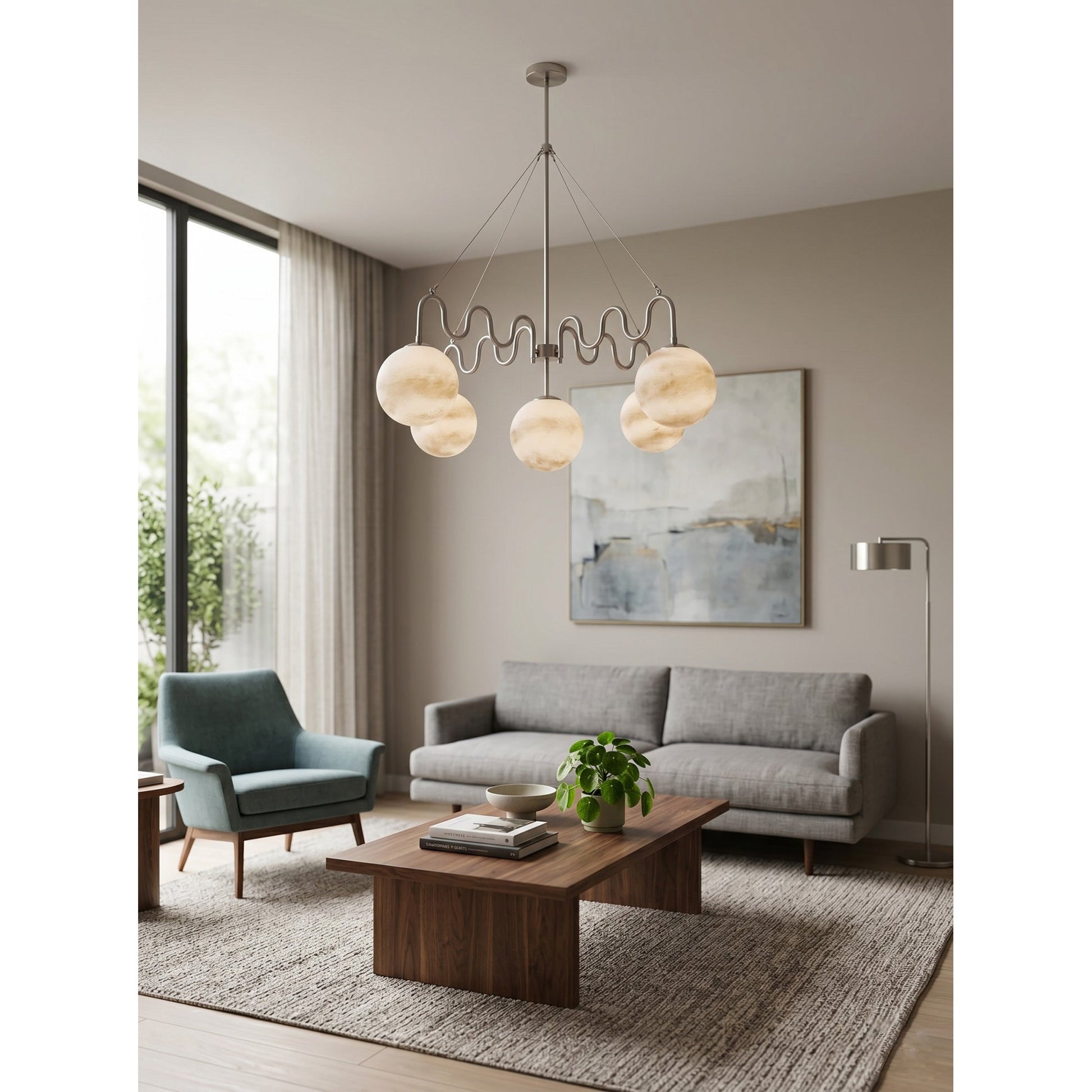 Full view of the brass Cecil Chandelier, showcasing its balanced, wave-like form.