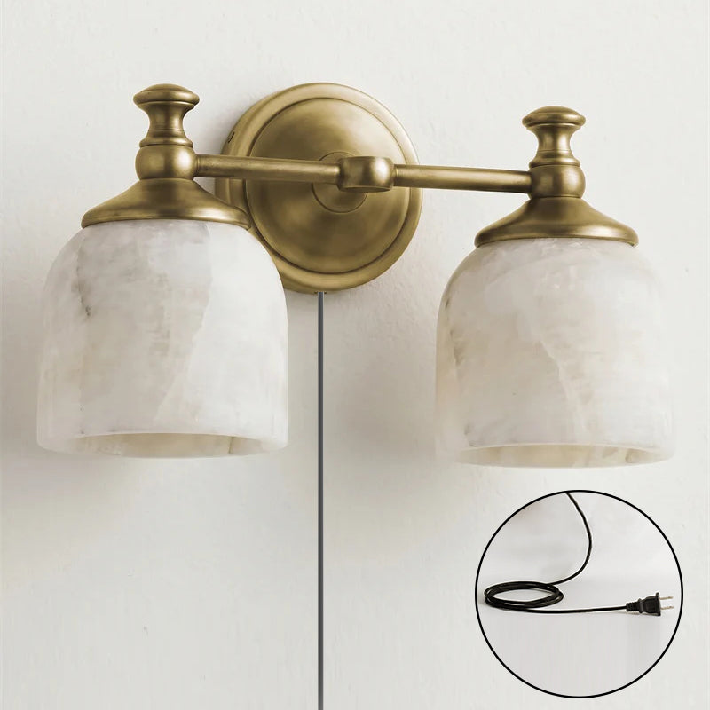 Angled view of the Chart Alabaster Wall Sconce in brass finish.
