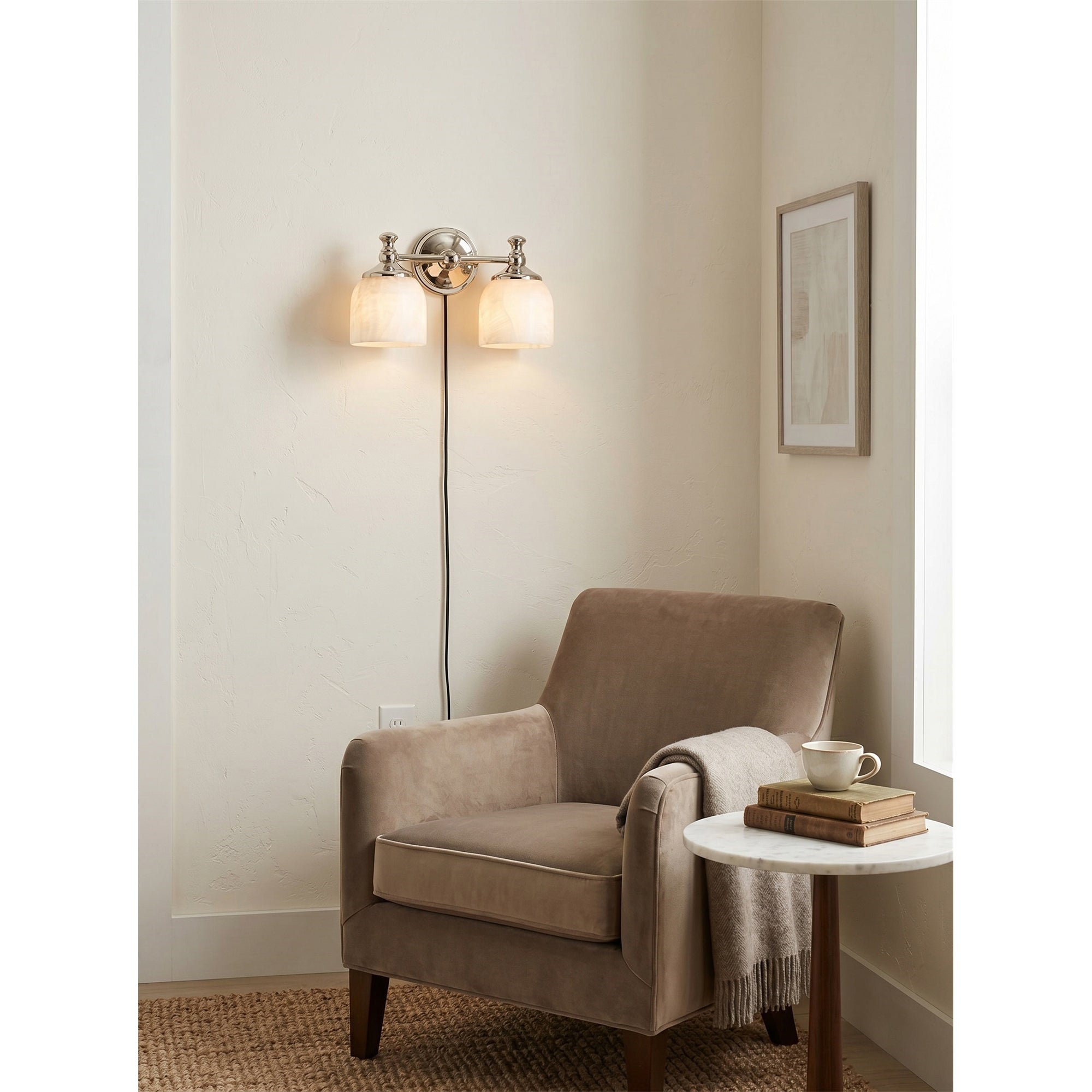 The polished nickel finish option of the Chart Alabaster Wall Sconce.