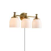 Chart Glass Plug-in Wall Sconce in aged brass finish.