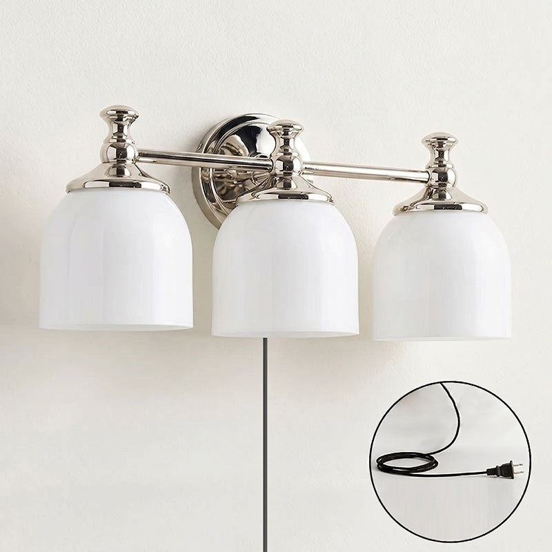The sconce casting a warm, ambient glow in a dim room.