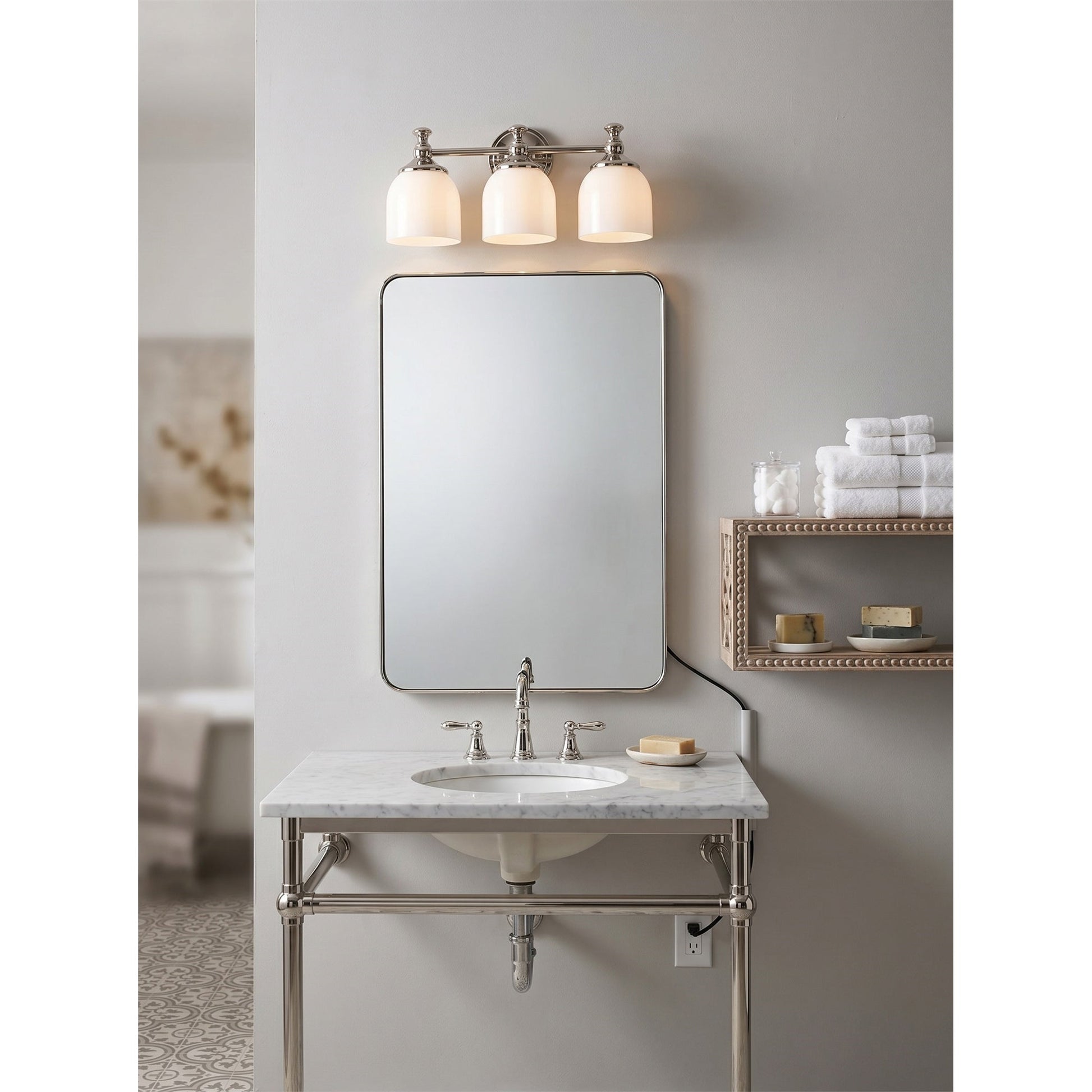 Lifestyle view of the sconce used as a bedside reading light.