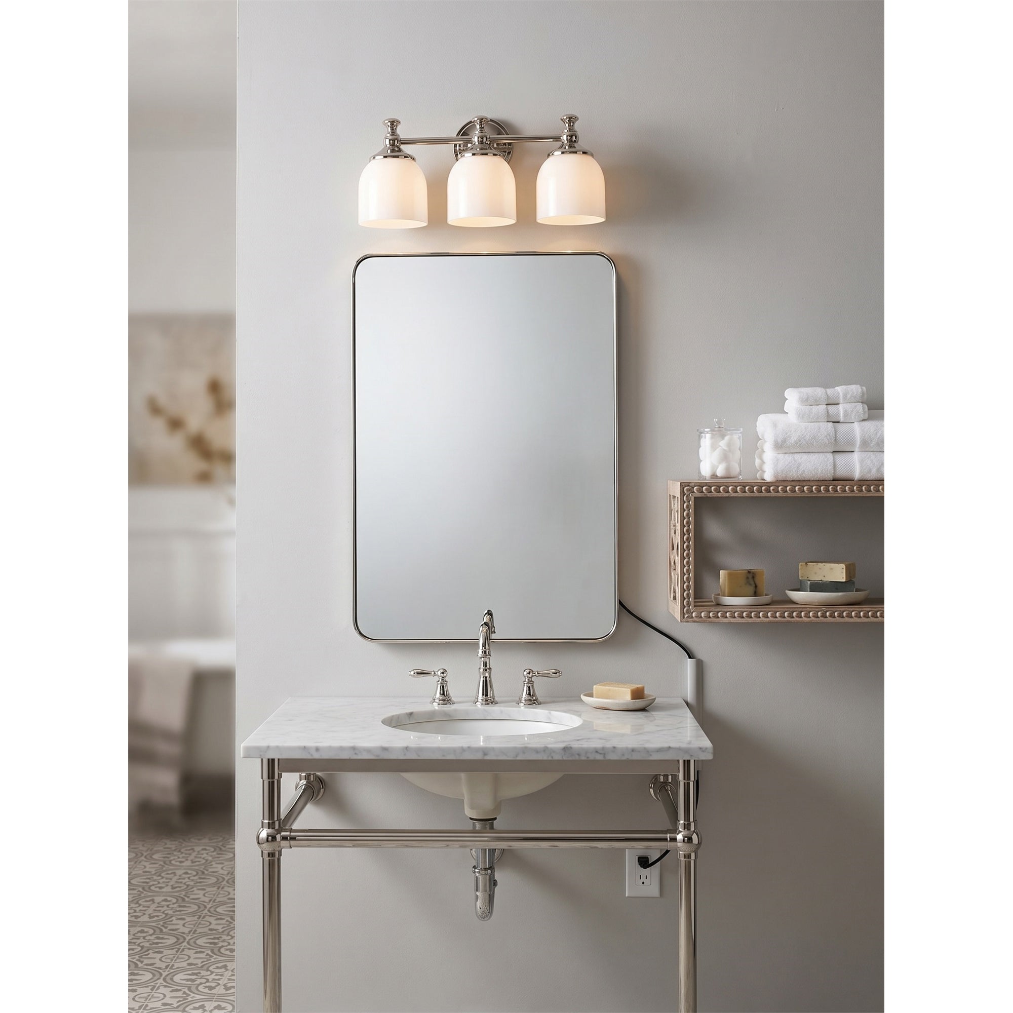 Lifestyle view of the sconce used as a bedside reading light.