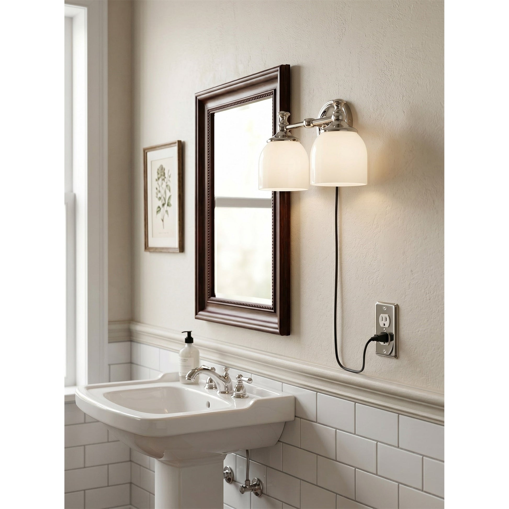 The sconce illuminating a gallery wall with warm light.