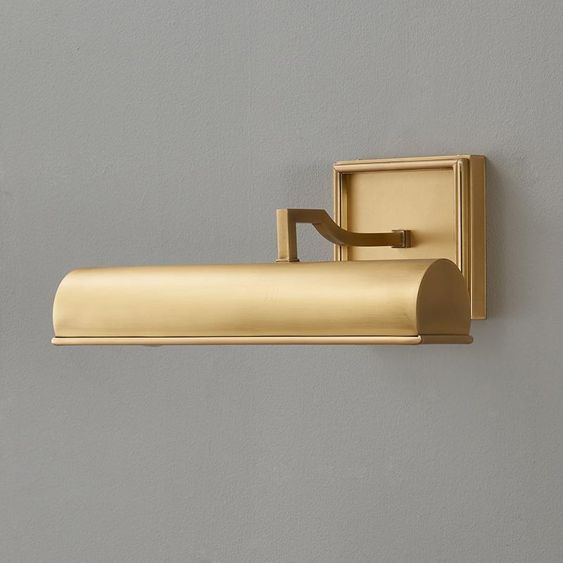 The brass finish of the Chawton Sconce in natural light.