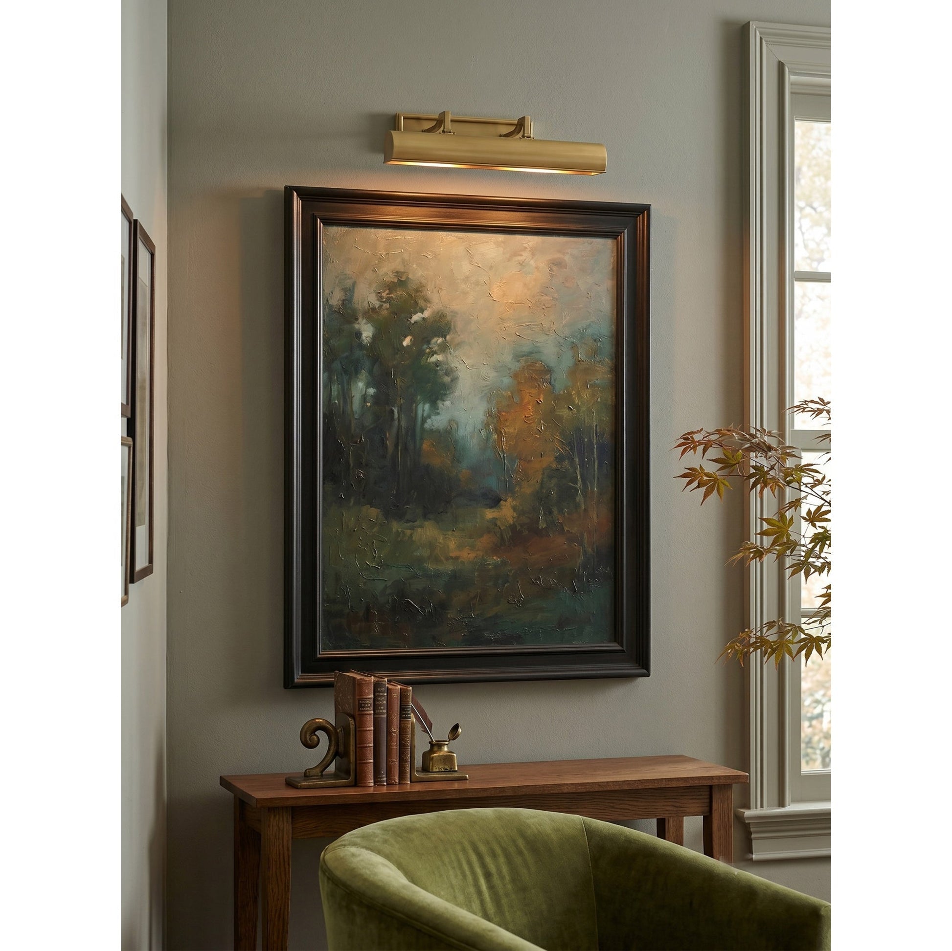 Chawton Wall Sconce in bronze antiquing finish against a light wall.