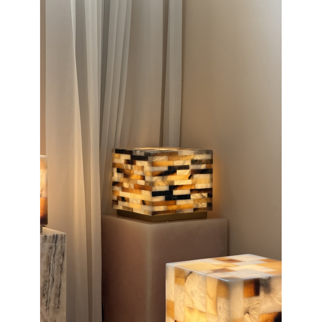 The lamp as a sculptural art piece on a shelf.