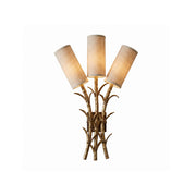 Front view of the Chelsea Wall Sconce with its gold branch-like frame and three white fabric shades.
