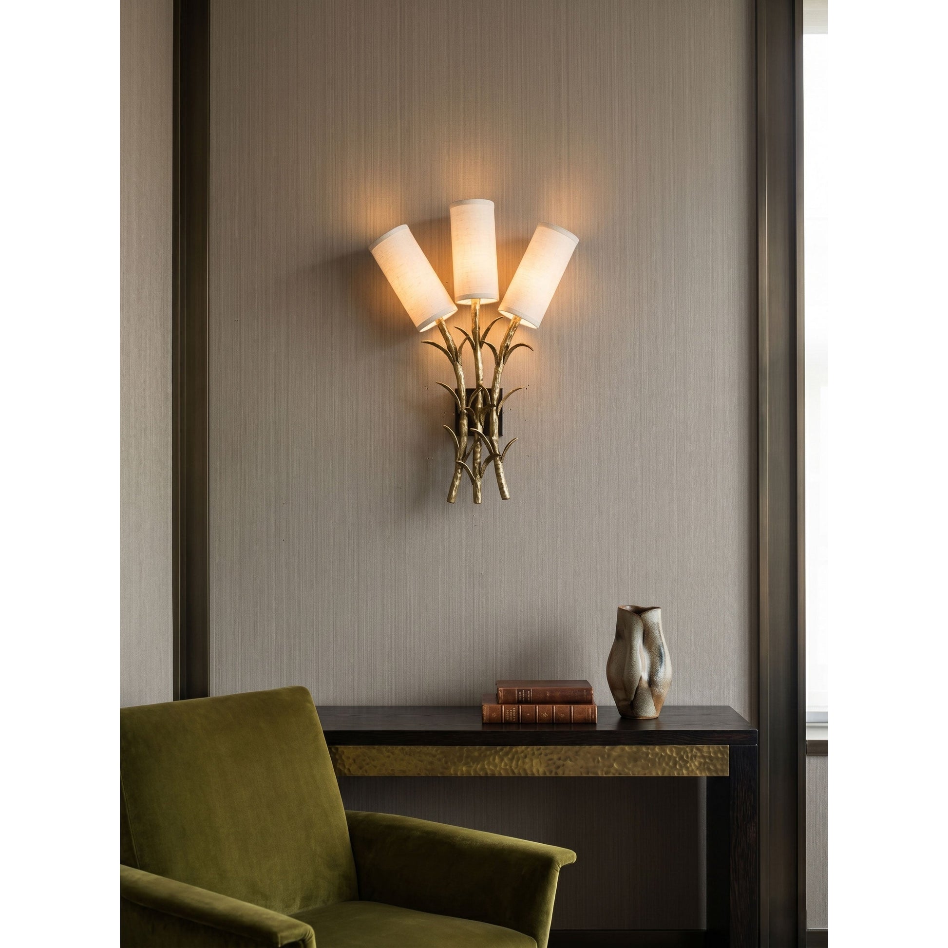 View of the sconce from below, showing the three candelabra sockets.