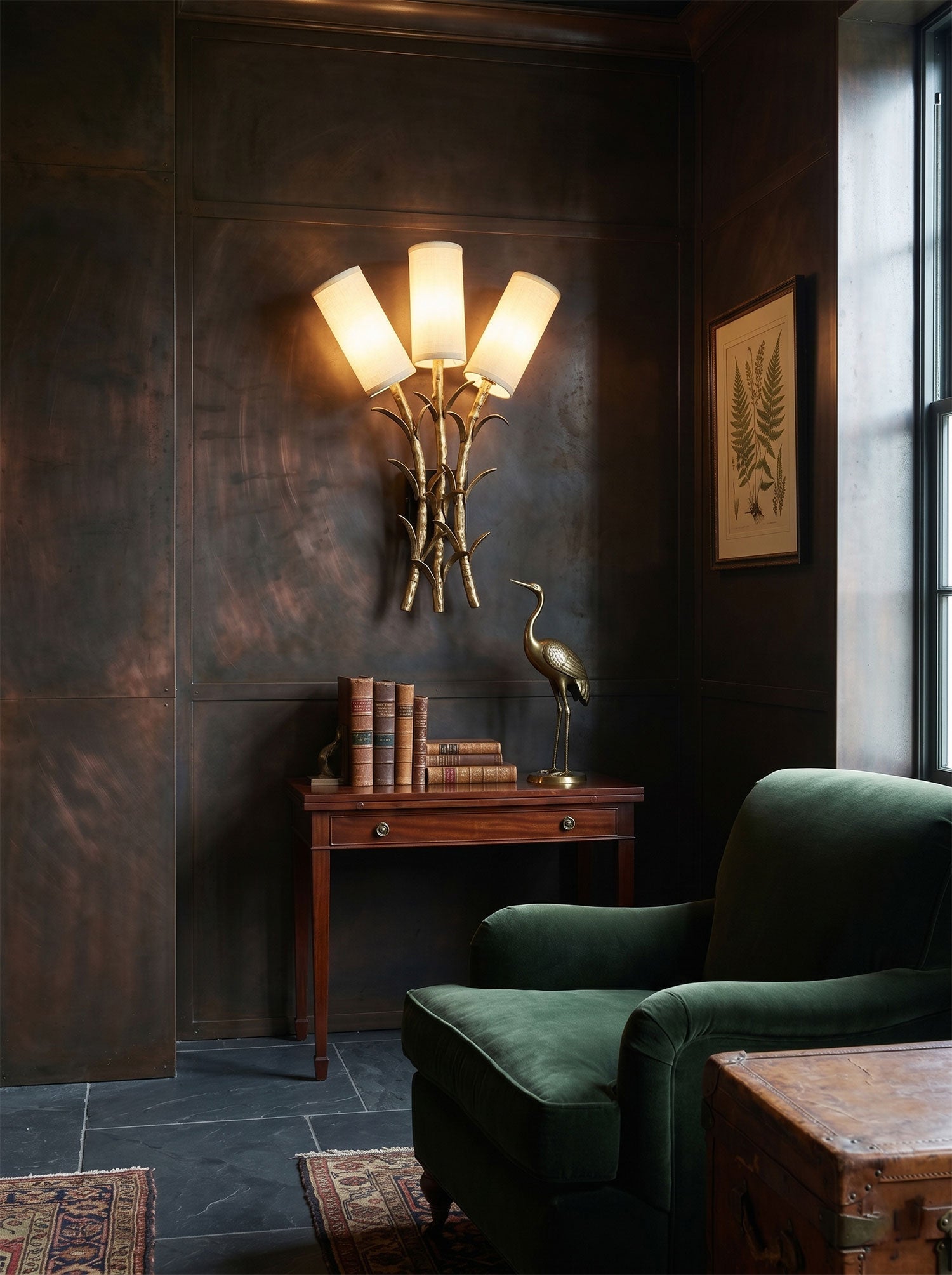 Angled view of the Chelsea Wall Sconce, highlighting the texture of the antique brass finish.
