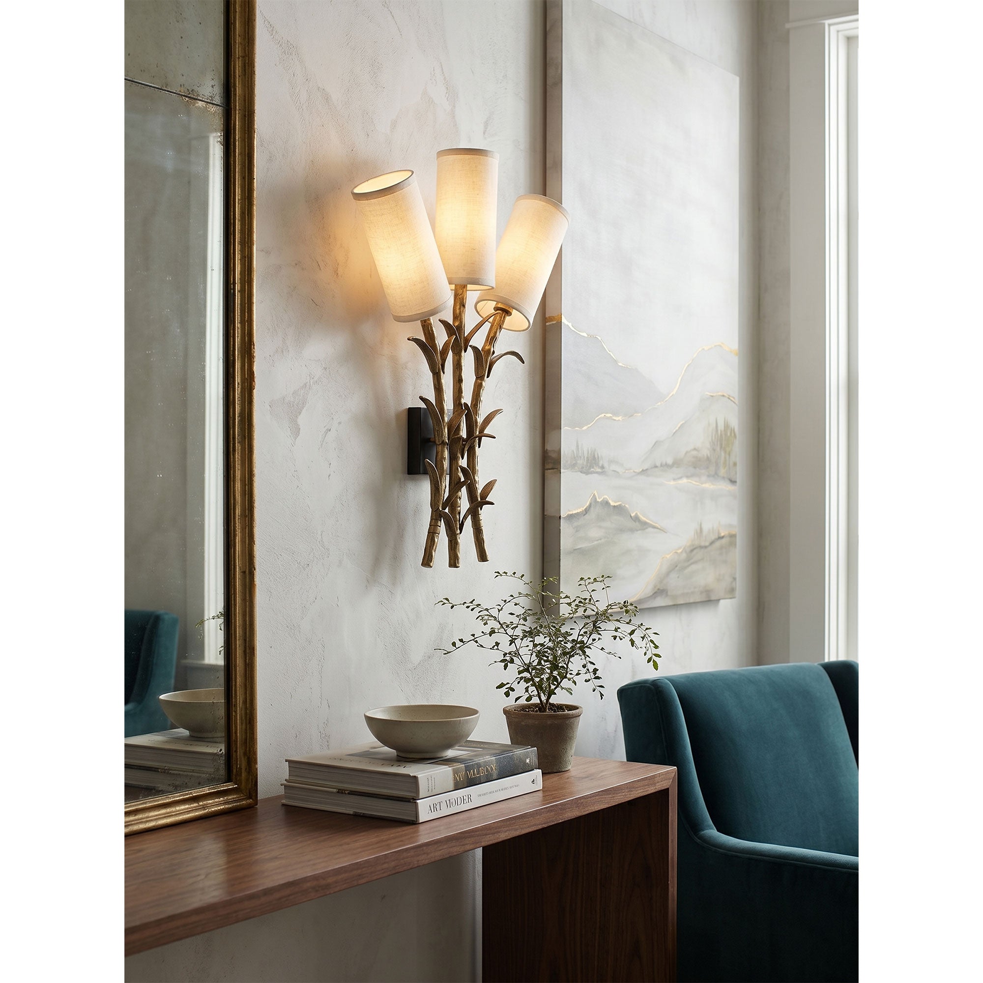 The wall sconce shown against a dark wall to emphasize its sculptural form.