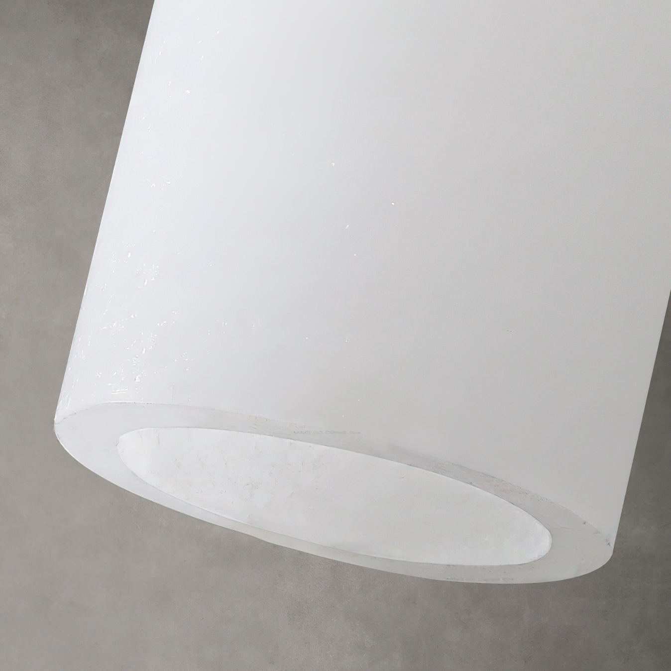 The cascading silhouette of the multi-light pendant cluster.