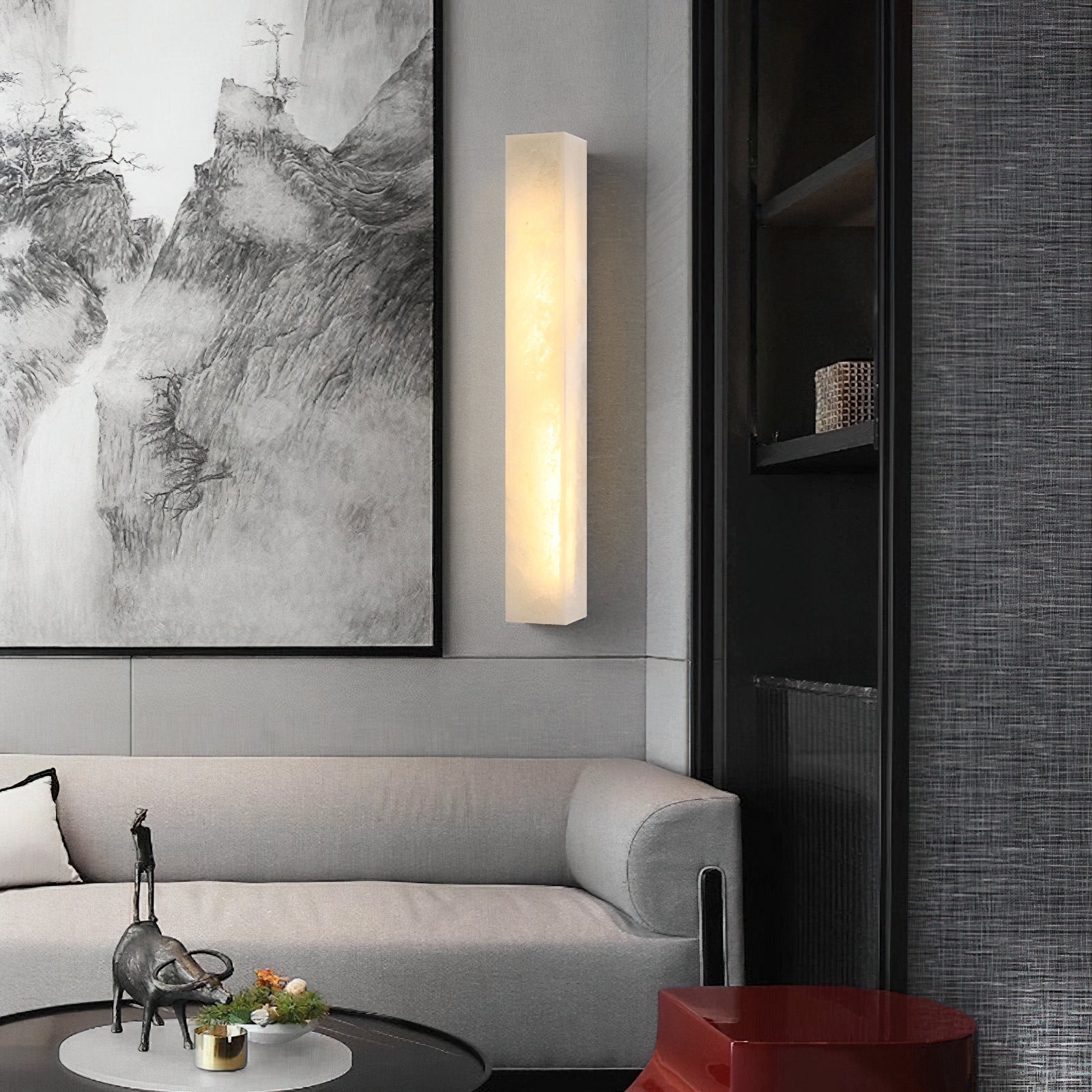 Dara wall sconce styled above an entryway console table.