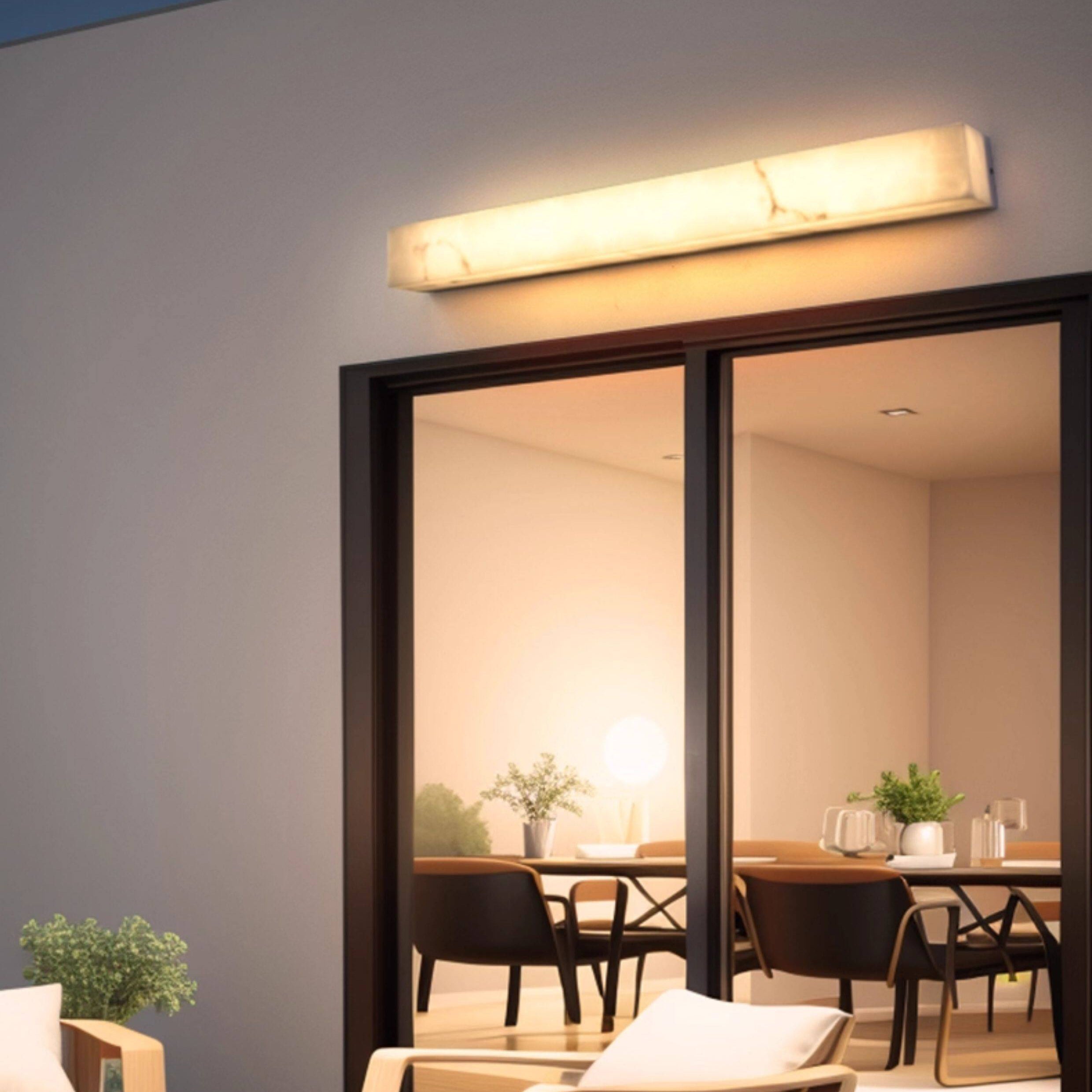 A pair of Dara wall sconces in a minimalist living room.