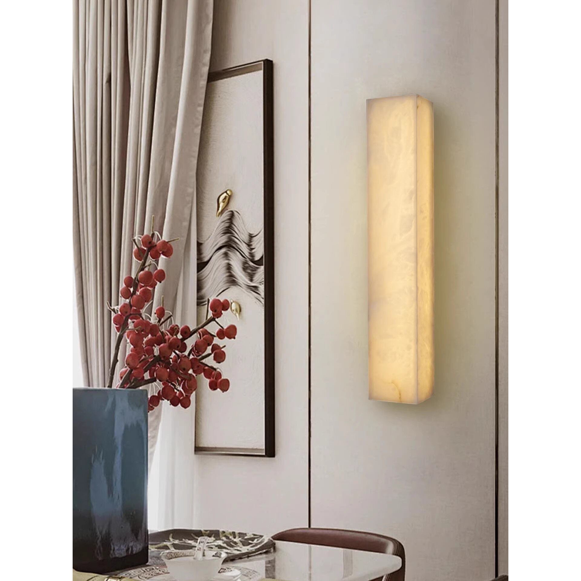 Dara wall sconce turned on, highlighting the unique veining.