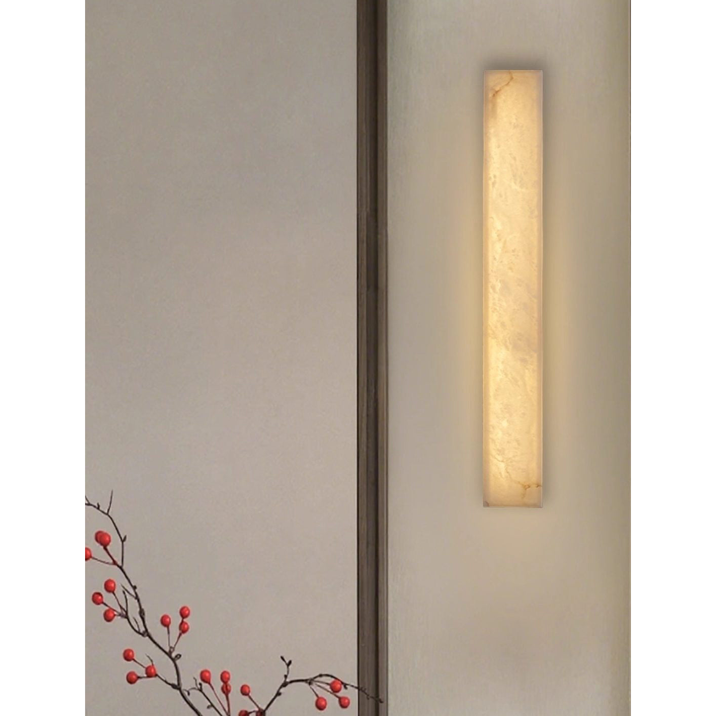 Angled view of the Dara long alabaster wall sconce.