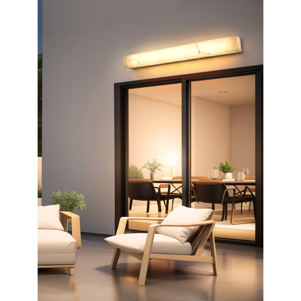 The 60cm Dara wall sconce shown in a hallway.