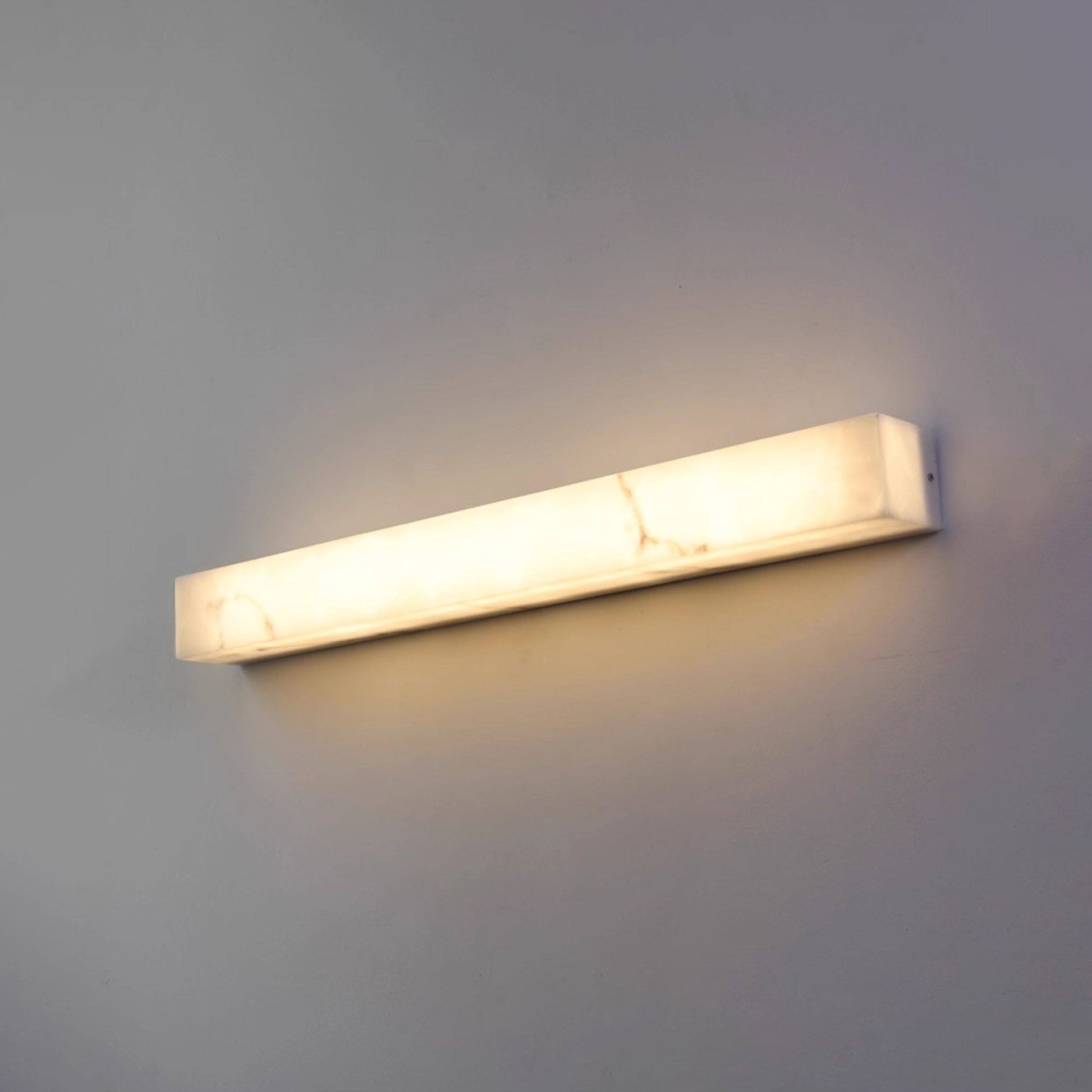 The seamless block construction of the Dara wall sconce.
