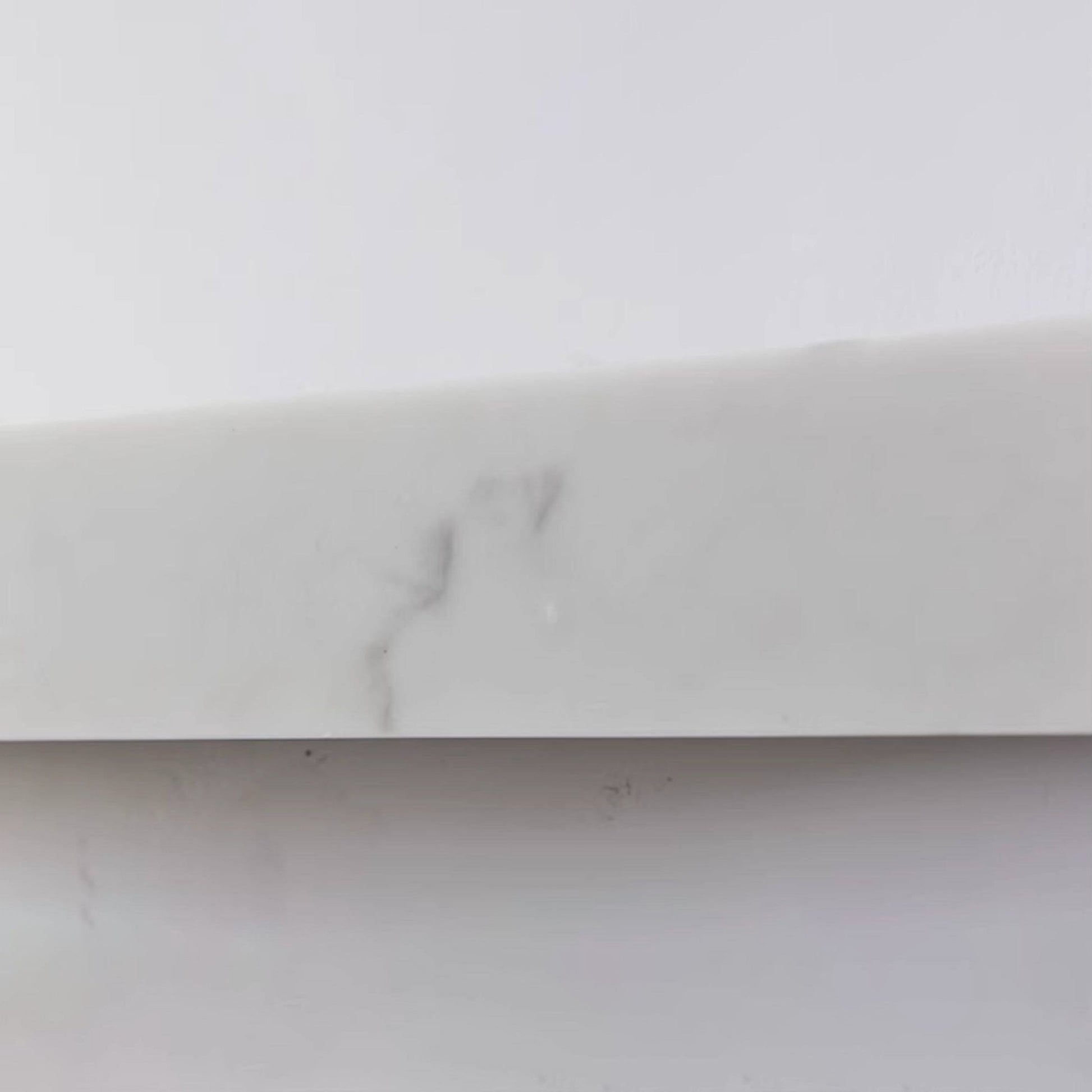 Minimalist interior featuring the Dara alabaster wall sconce.