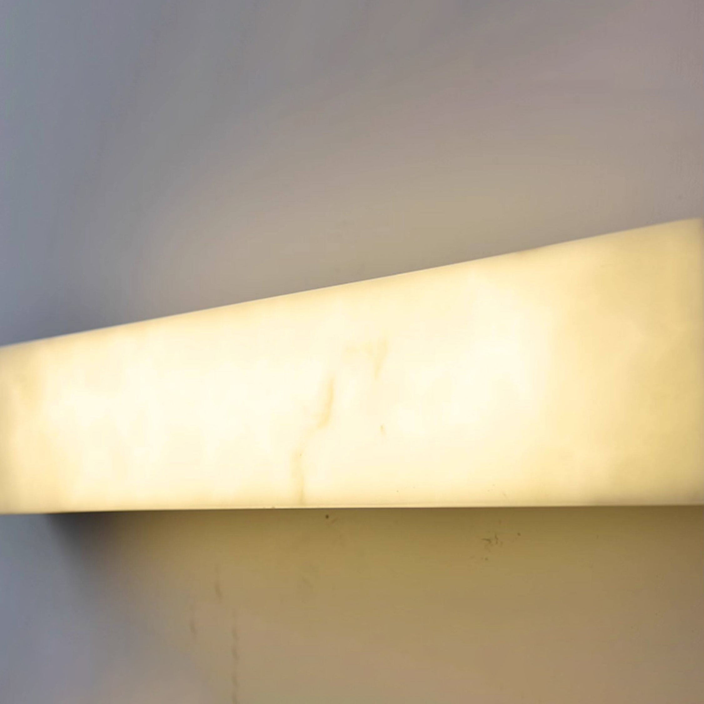 Dara long alabaster wall sconce, full product view.