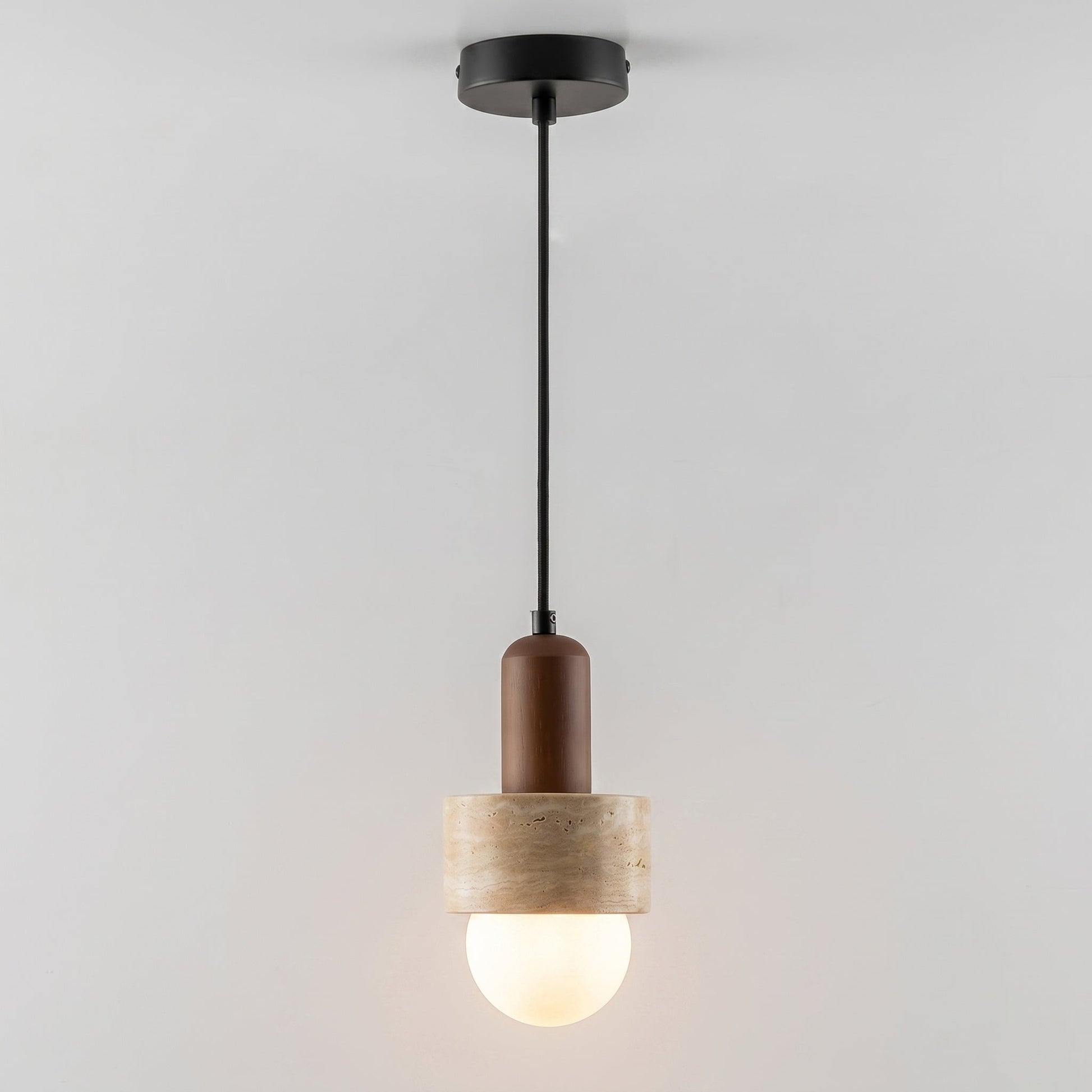 The frosted glass globe diffusing a soft light.