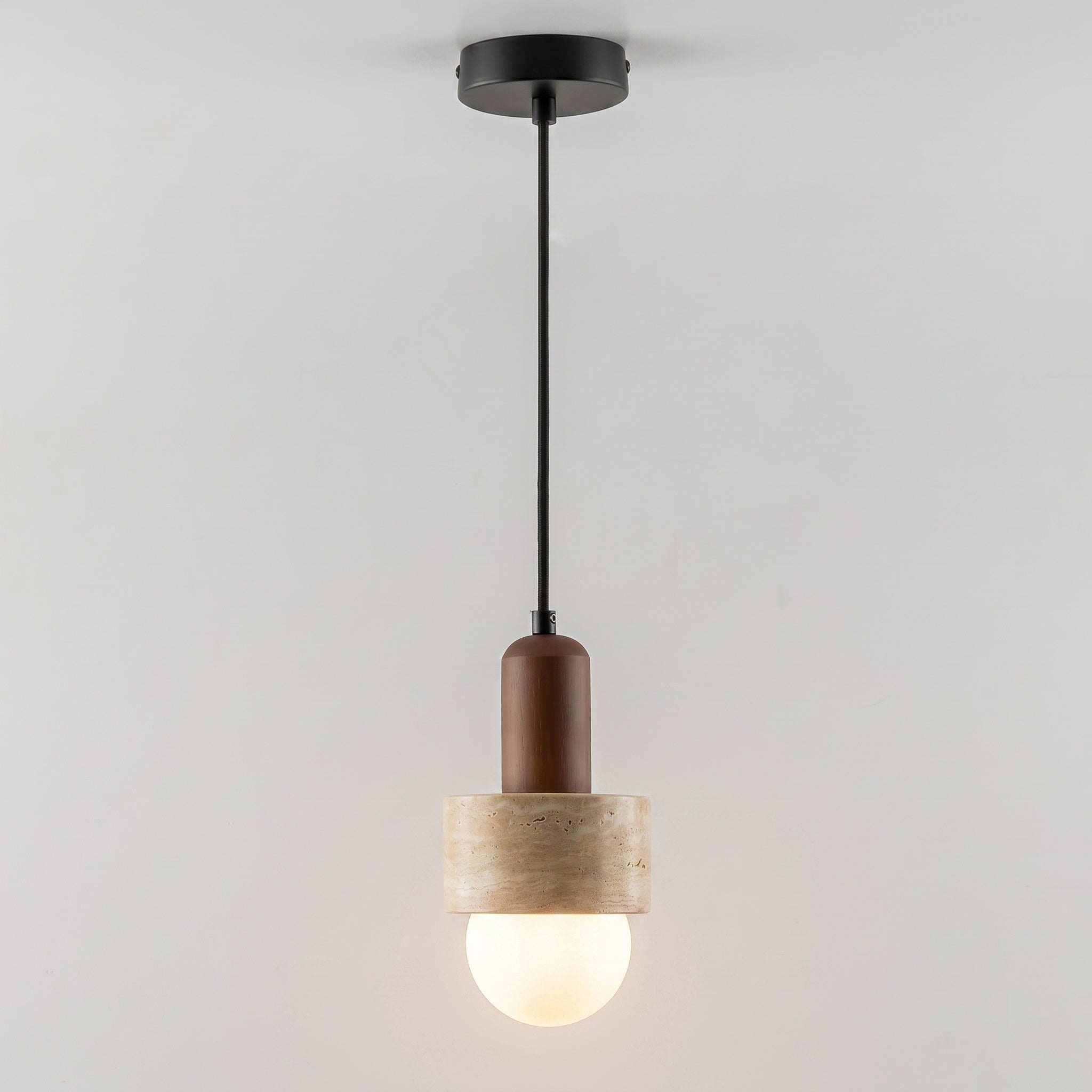 The frosted glass globe diffusing a soft light.
