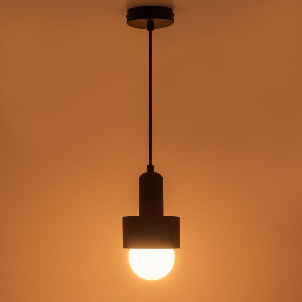 Studio shot of the Davise Pendant Lamp on a dark background.