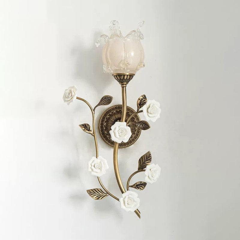 The sconce from a lower angle, looking up at the glass shade.