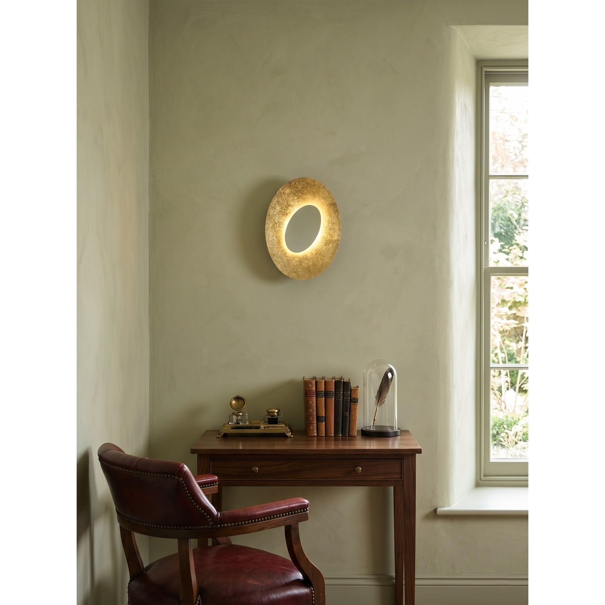 Lifestyle image of the Escale Blade Wall Sconce in a modern entryway.