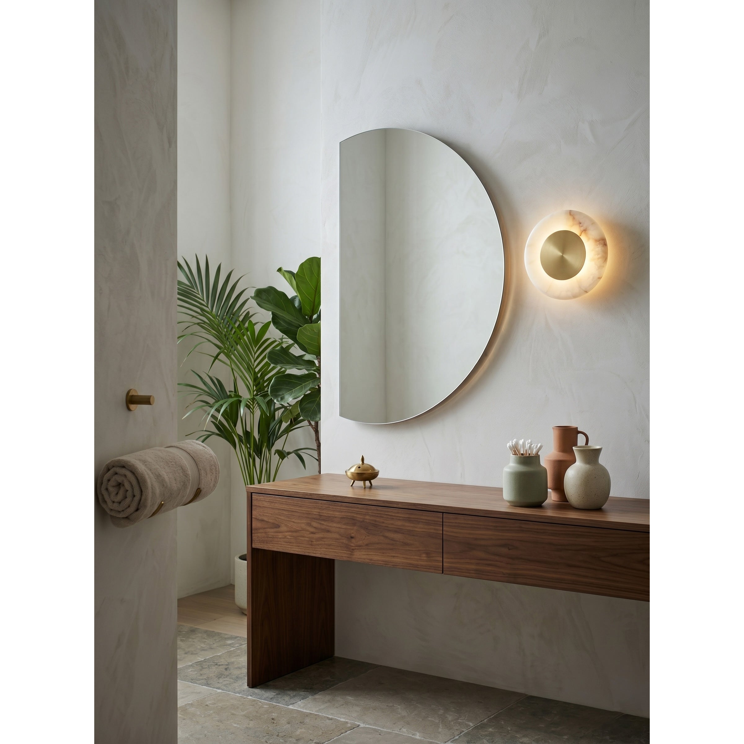 The Cyan Onyx sconce lit up in a dark room.