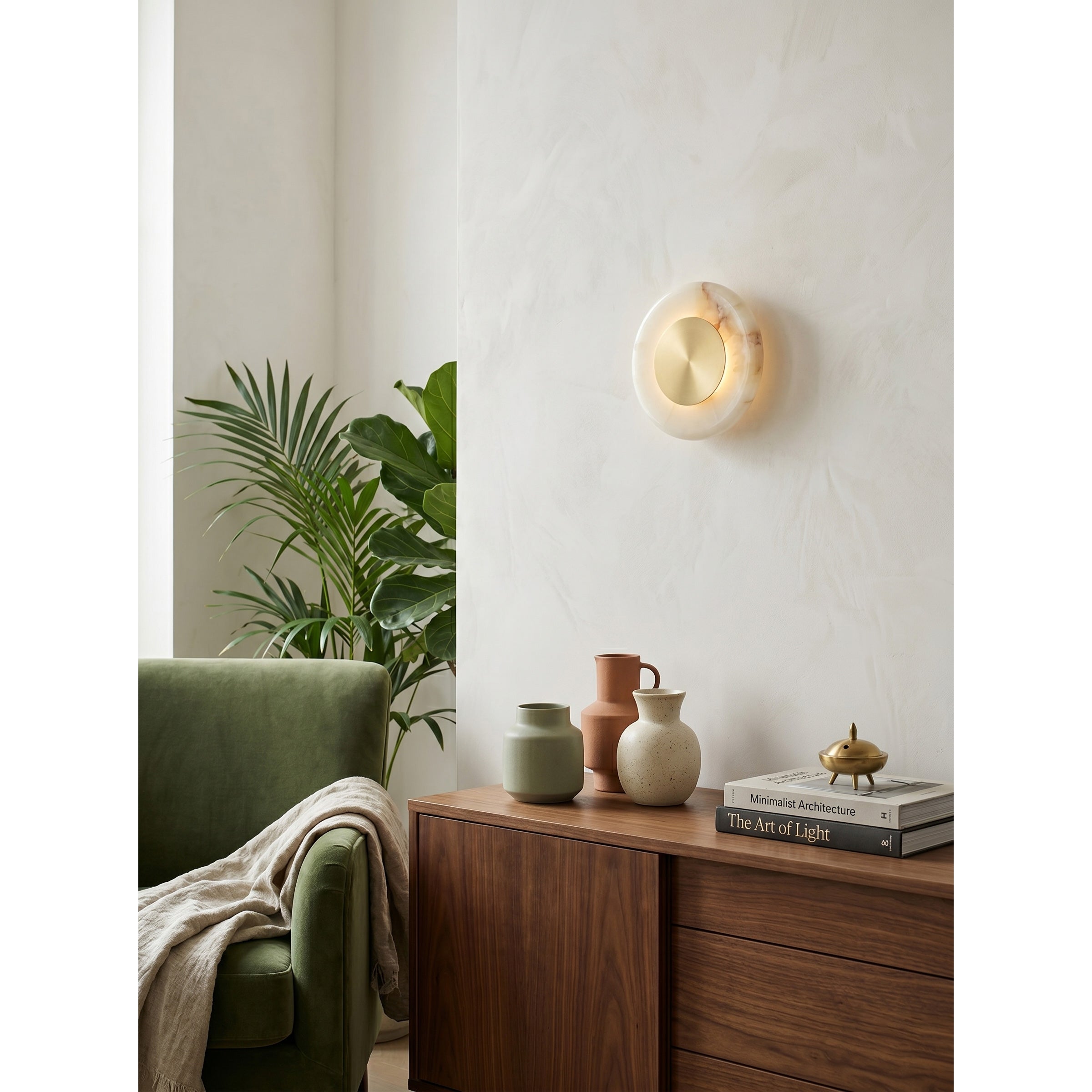 The sconce used as minimalist bedside lighting.