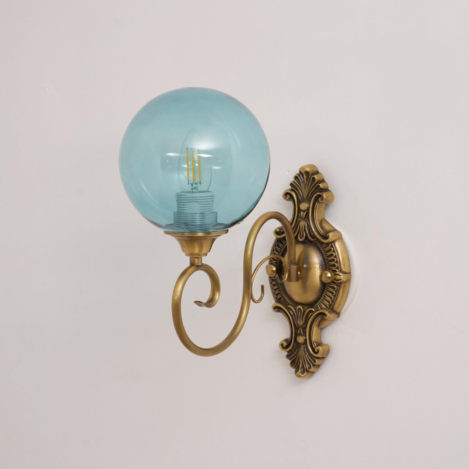 Angled view of the blue finish lamp, showing its cool tone.