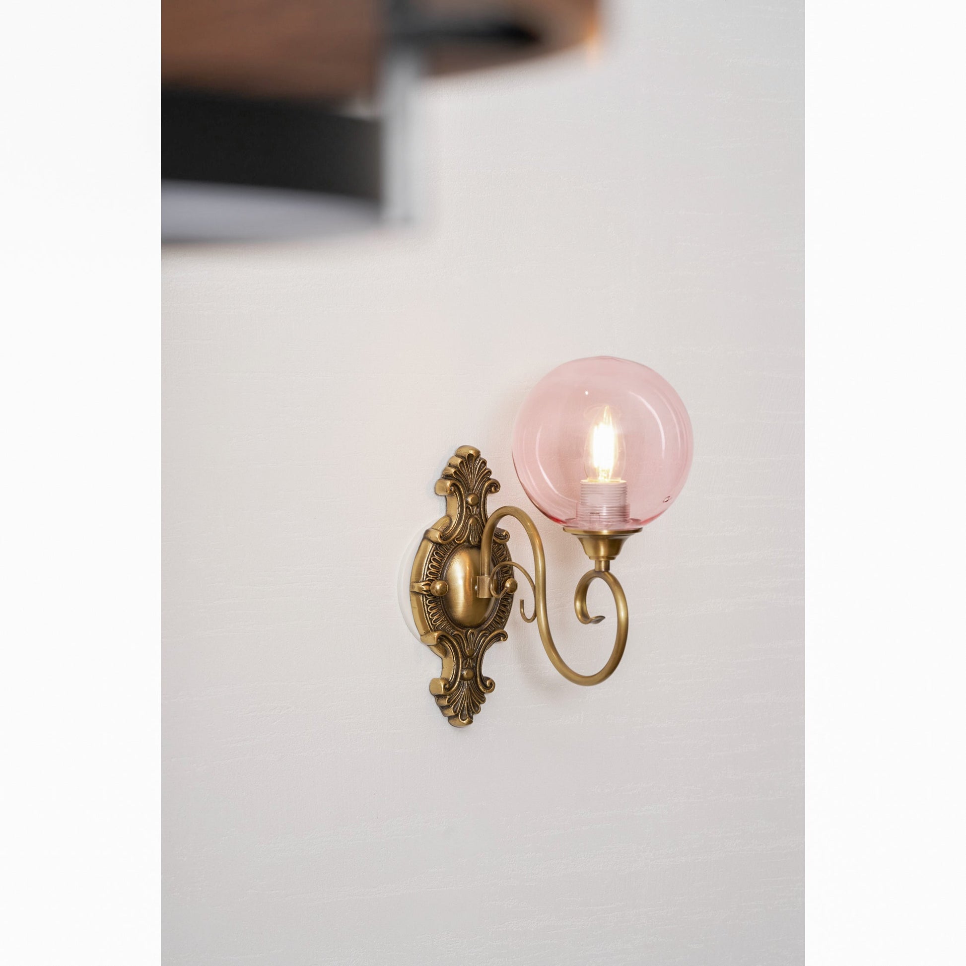 The Evelyn Wall Lamp in copper finish, shown from the side.