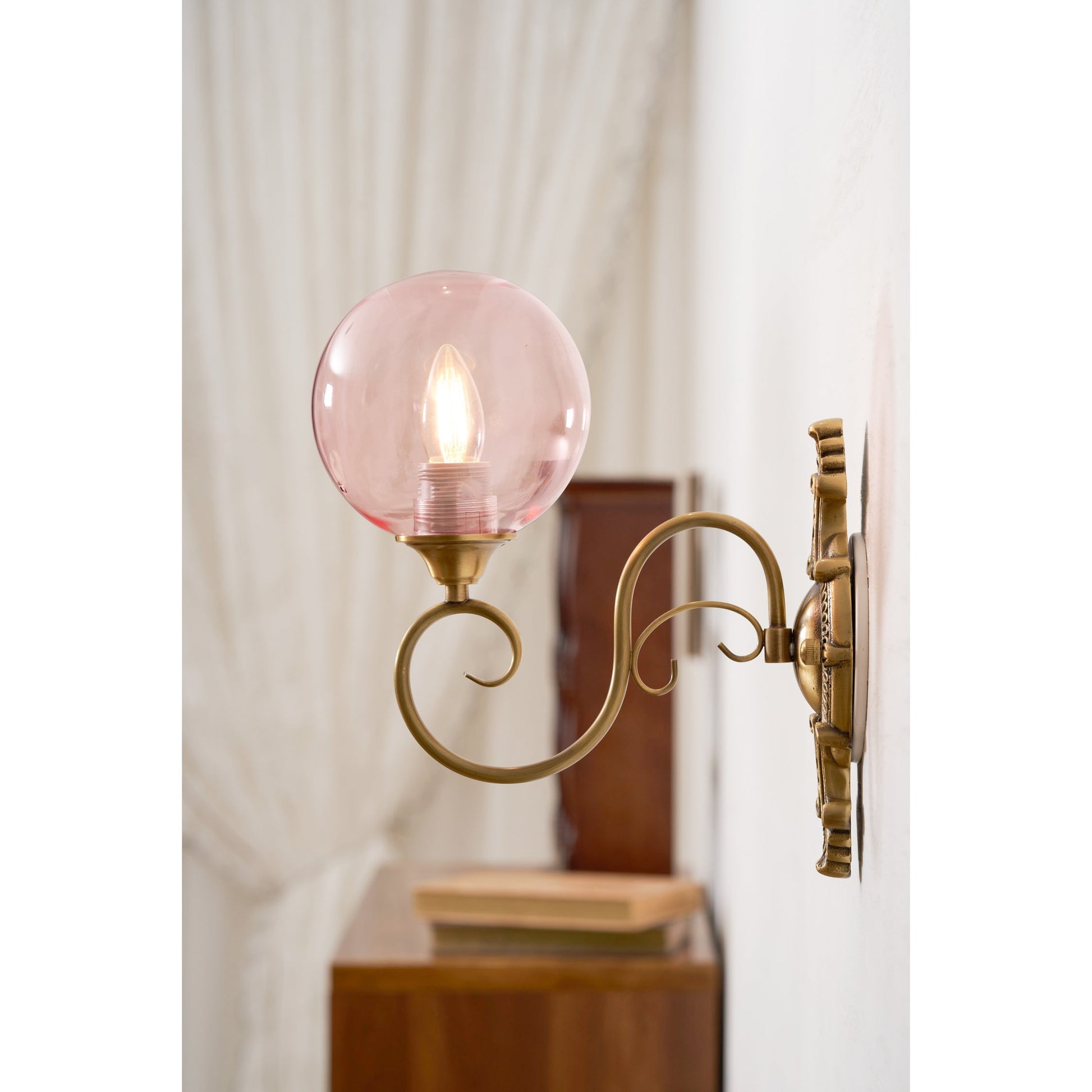 The lamp installed on a living room wall, providing ambient light.