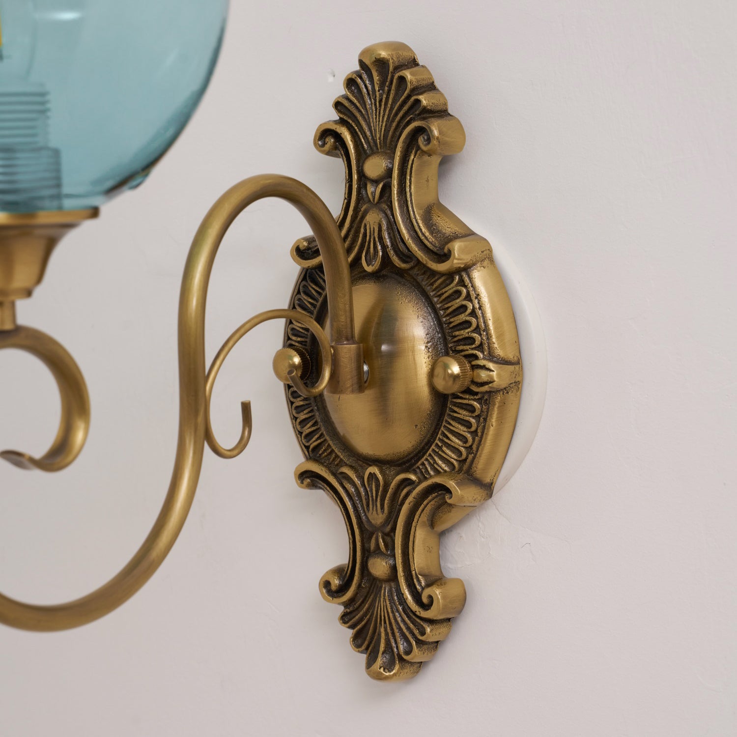 The Evelyn Wall Lamp casting patterns of light and shadow on a wall.