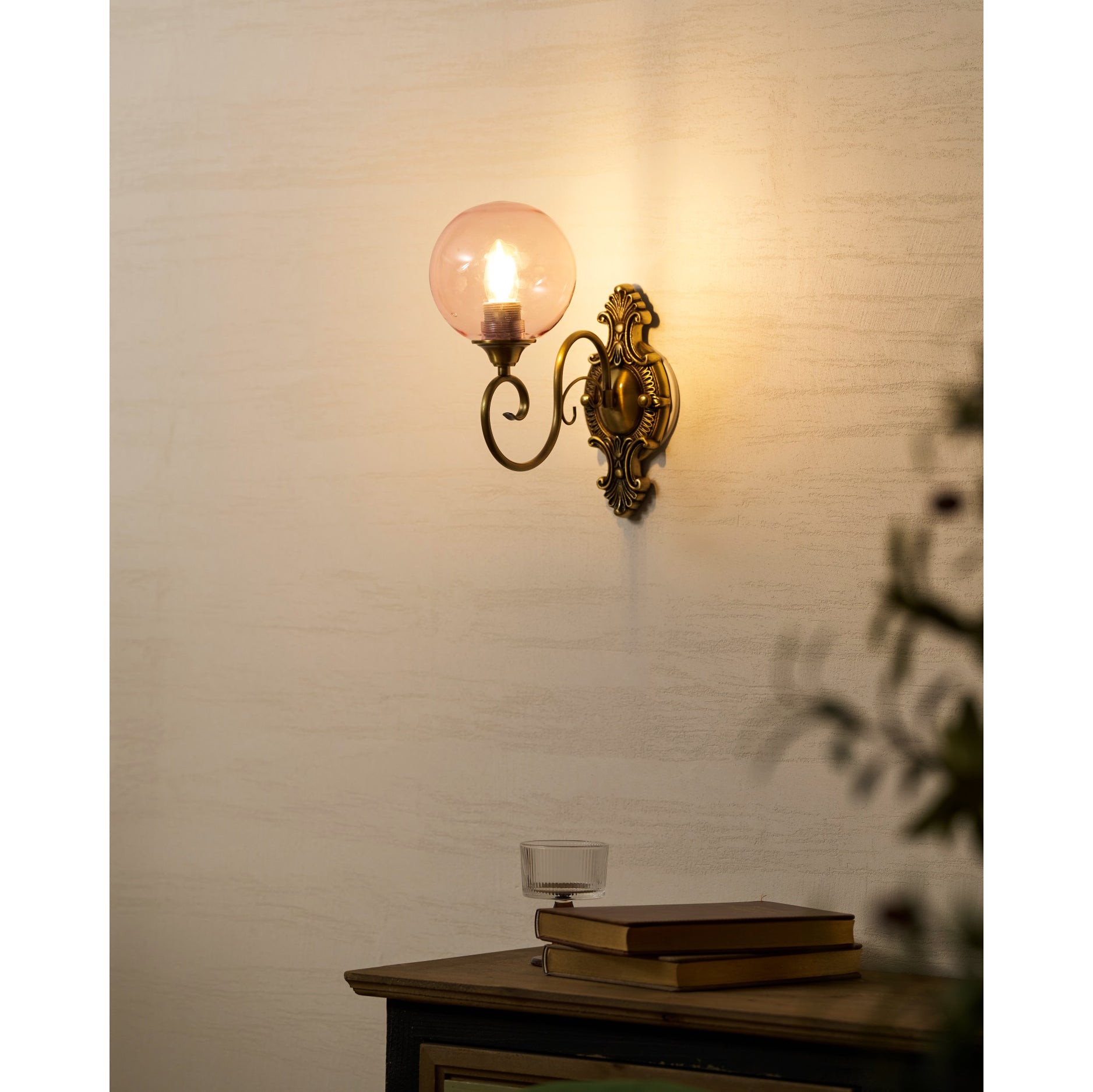 The Evelyn Wall Lamp in blue finish, close-up on the glass.