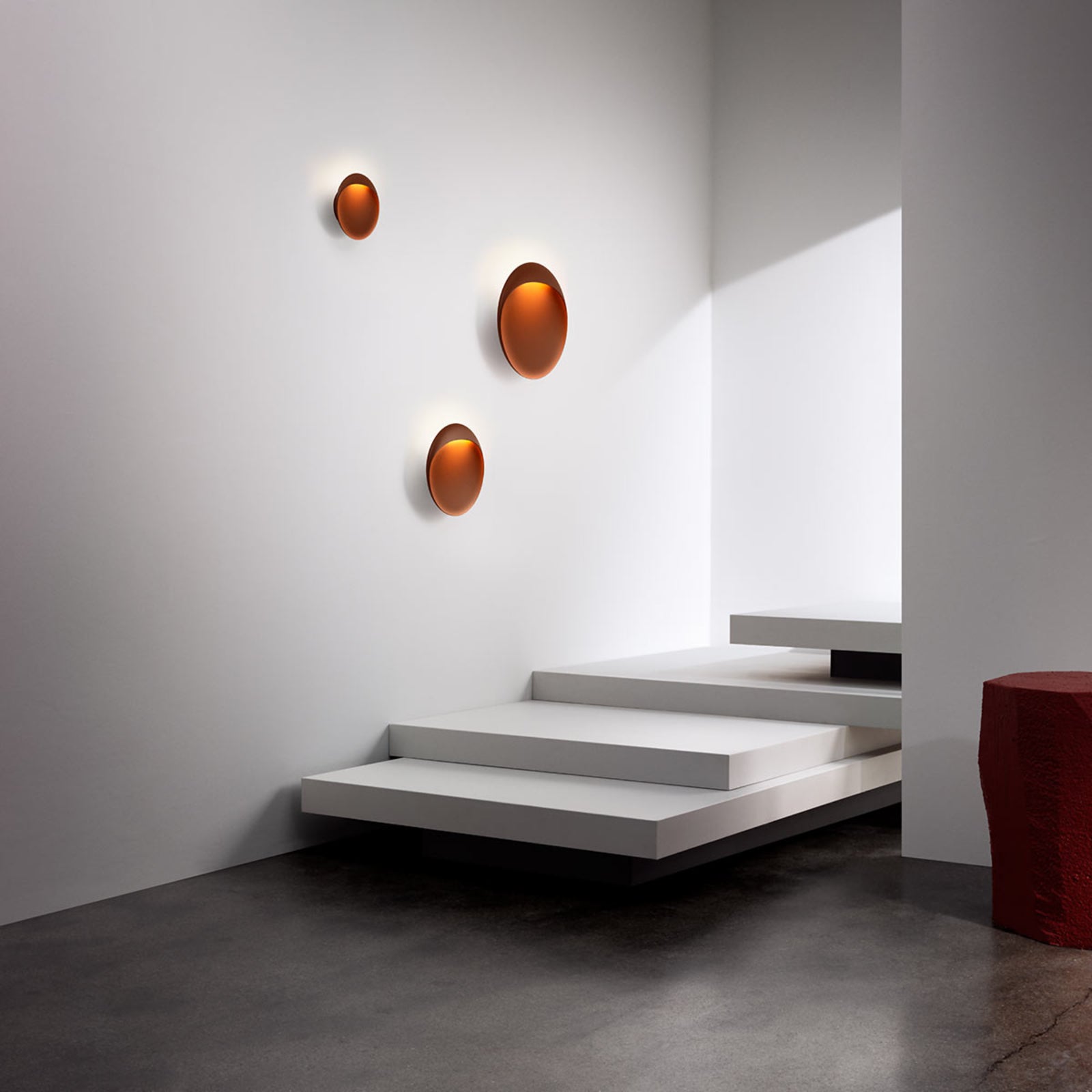 A pair of white Flindt sconces in a modern hallway.