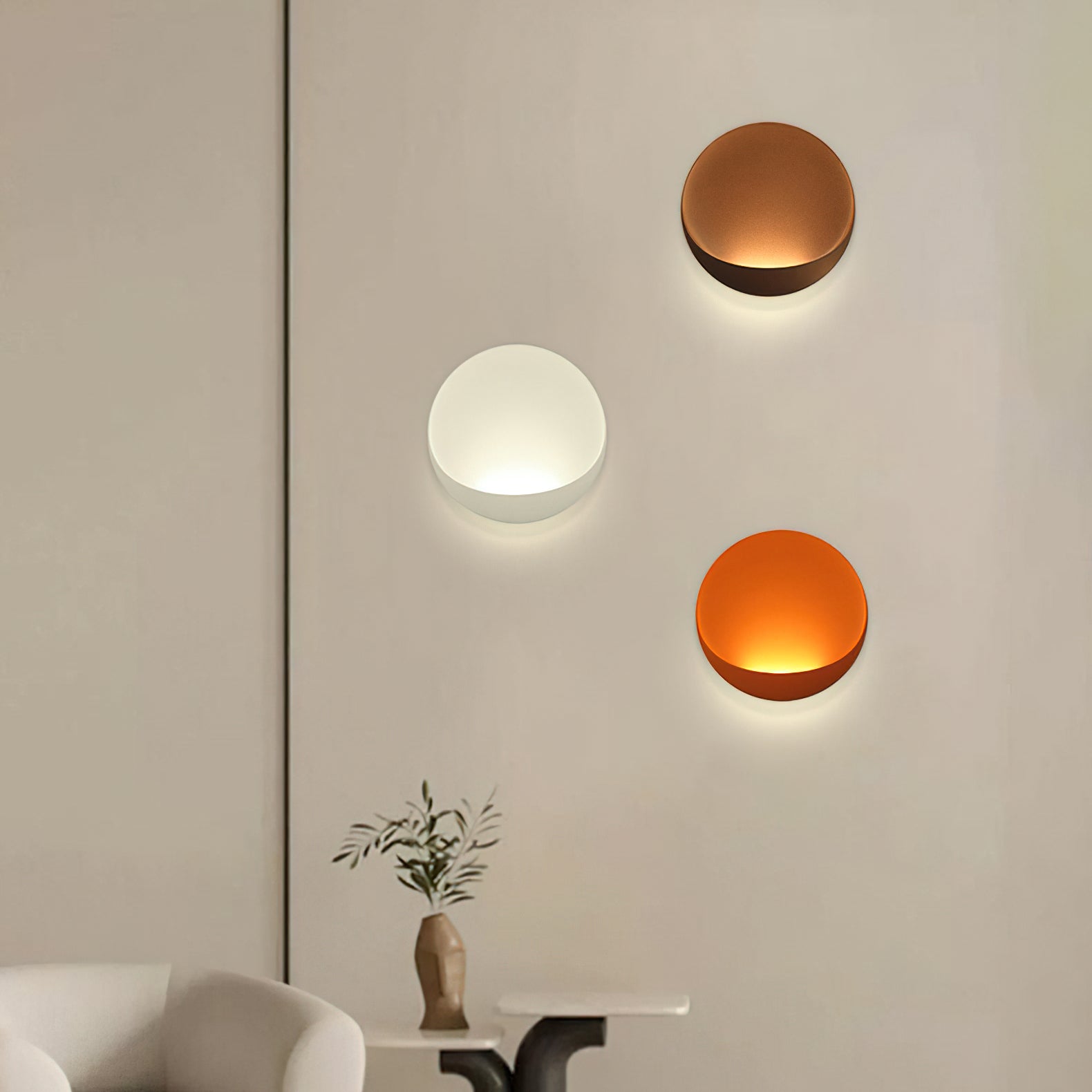 Lifestyle view of a light gray Flindt sconce in a bedroom.