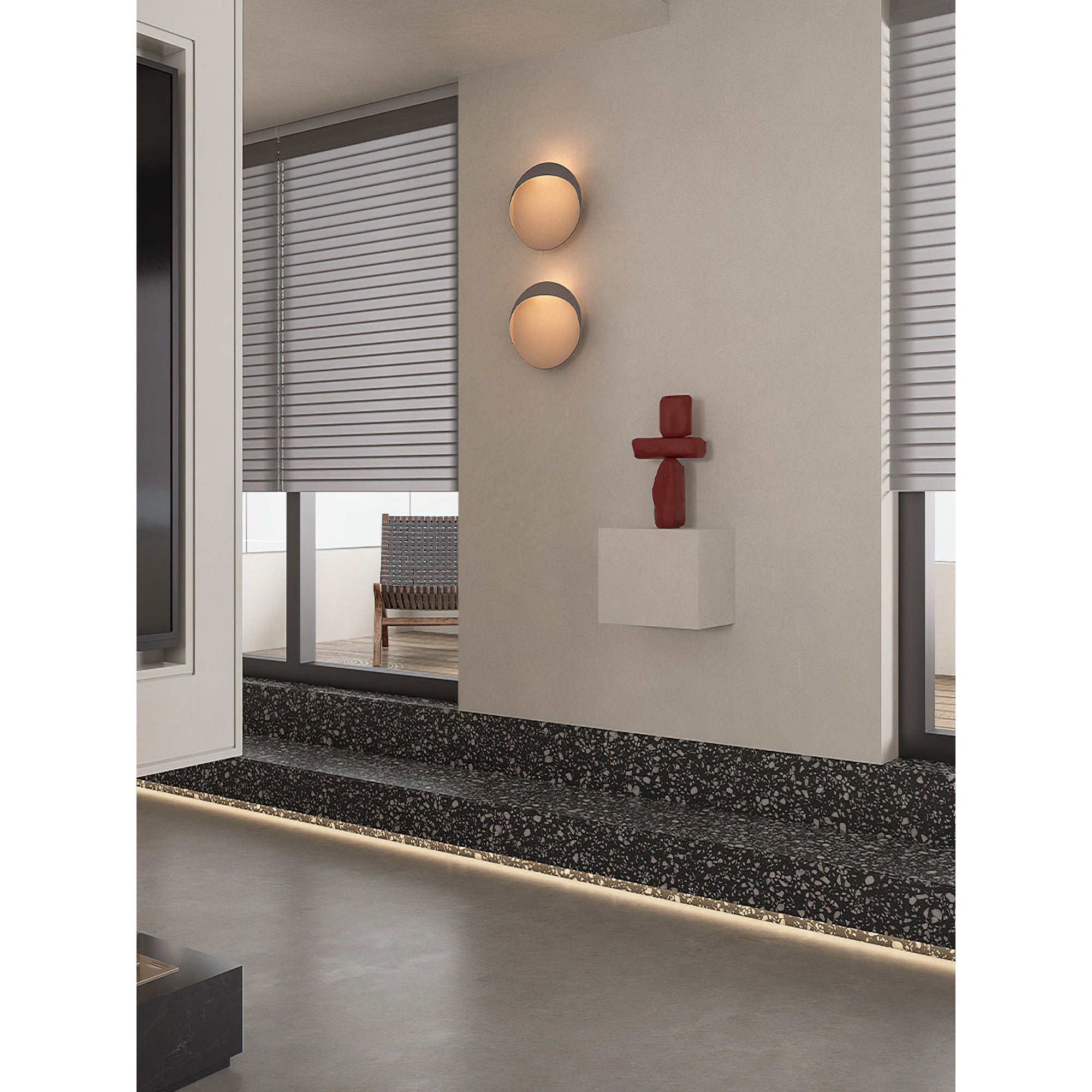 Black Flindt sconce providing accent lighting in an entryway.