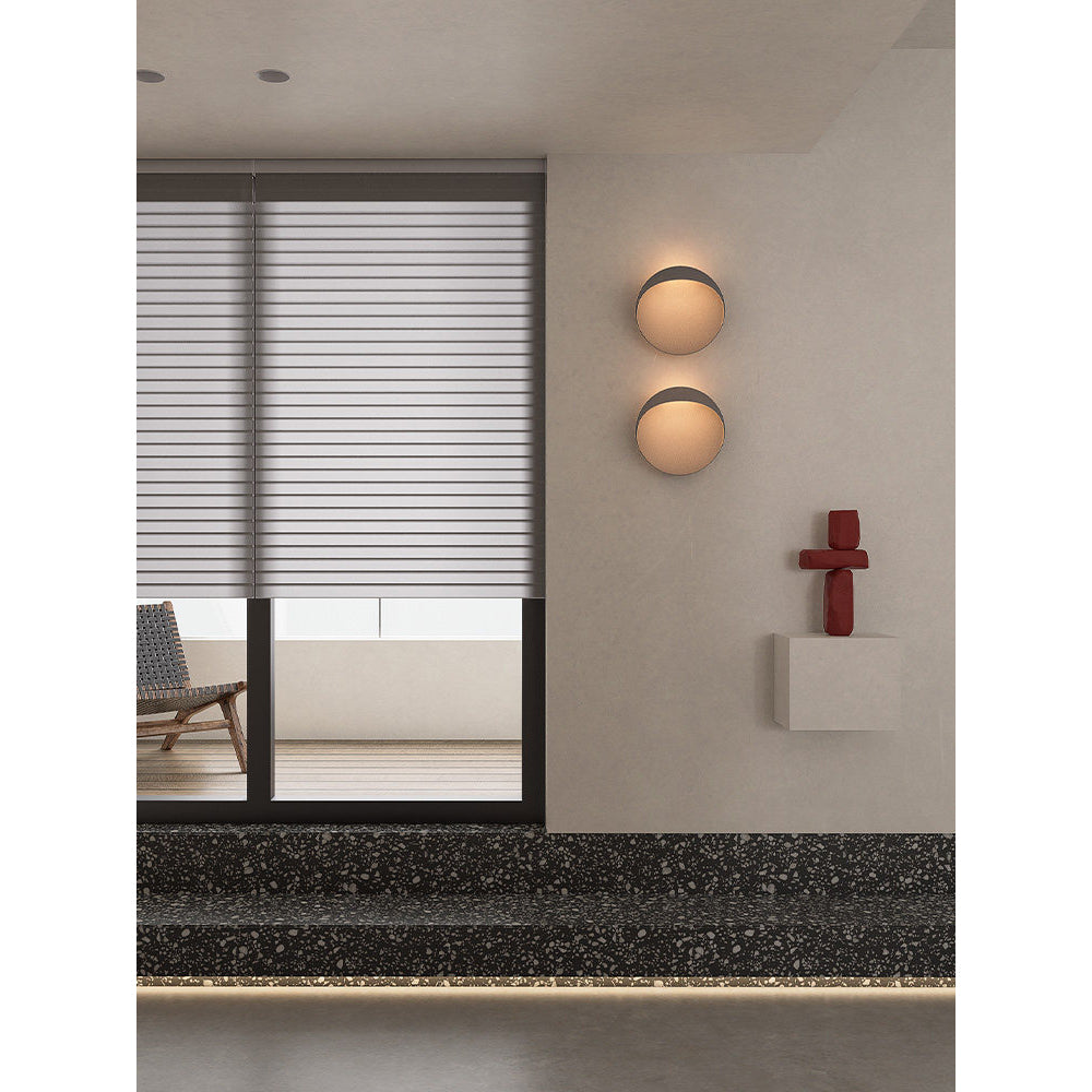 Coffee-colored Flindt sconce shown from the side.